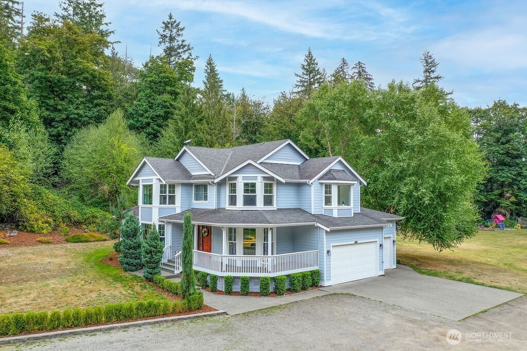 Exquisite, one-of-a-kind Estate nestled on 21+ Acres! Extra long, tree-lined driveway leads to Idyllic Modern Victorian Farmhouse! Updated w/dreamy wraparound porch & Sunroom off back. Beautiful, large windows grant an abundance of light throughout home! Classic white kitchen w/Farmhouse Sink, heated tile floor, quartz counters, movable island, tile backsplash & SS appliances. Sprawling Backyard w/patio, fire pit & huge open space. Separate detached accessory, use as possible office, hobby room, playhouse etc. Two water heaters, A/C & built-in vacuum. Unincorporated King County area; desirable Lake Holm community. Two separate parcels included in sale; Bring all your country & equestrian dreams to life in your own haven!