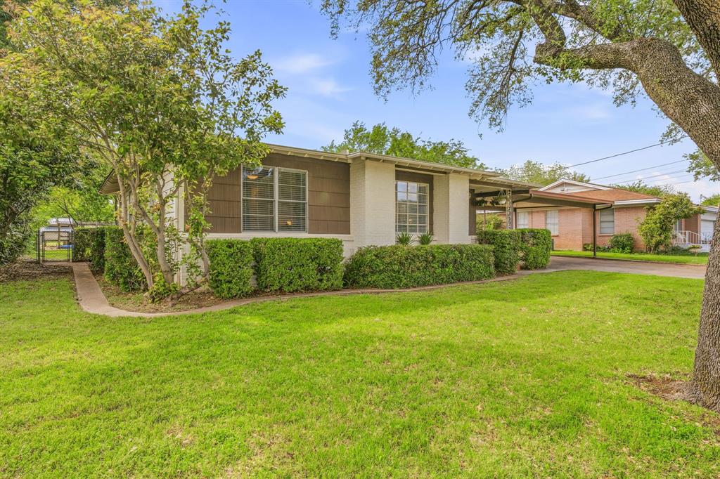 Beautifully restored 1953 home in Fort Worth, fully updated while preserving its original charm and character. Located near the desirable Ridglea area, this move in ready 3 bedroom, 2 bathroom home sits on an oversized, tree filled lot just over 0.35 acres and offers a rare blend of modern upgrades and timeless design. Step inside to a bright, open concept layout with hardwood floors throughout, no carpet, and abundant natural light. The spacious living, dining, and kitchen areas flow seamlessly together, creating an ideal space for everyday living and entertaining. The fully updated kitchen features butcher block countertops, stainless steel appliances, gas range, wine fridge, pull out trash, and ample storage. Every detail has been thoughtfully updated, including all new lighting, fresh paint, and a recently renovated laundry room now conveniently located inside the home with additional cabinetry and workspace. The primary suite offers a beautifully tiled walk in shower with rain head, while both bathrooms have been tastefully refreshed. A 336 square foot bonus room provides flexible space for a home office, gym, or second living area (not included in listed square footage). Outside, enjoy a large covered patio perfect for entertaining, overlooking a private backyard with mature trees, fresh landscaping, fire pit, swing, dog run, and chicken coop. Chickens are allowed. Additional features include an oversized two car carport, recently constructed insulated shop with spray foam insulation and electricity, Nest thermostat, and numerous built ins that enhance the home’s charm. Conveniently located with easy access to major highways, shopping, dining, and Lockheed Martin.