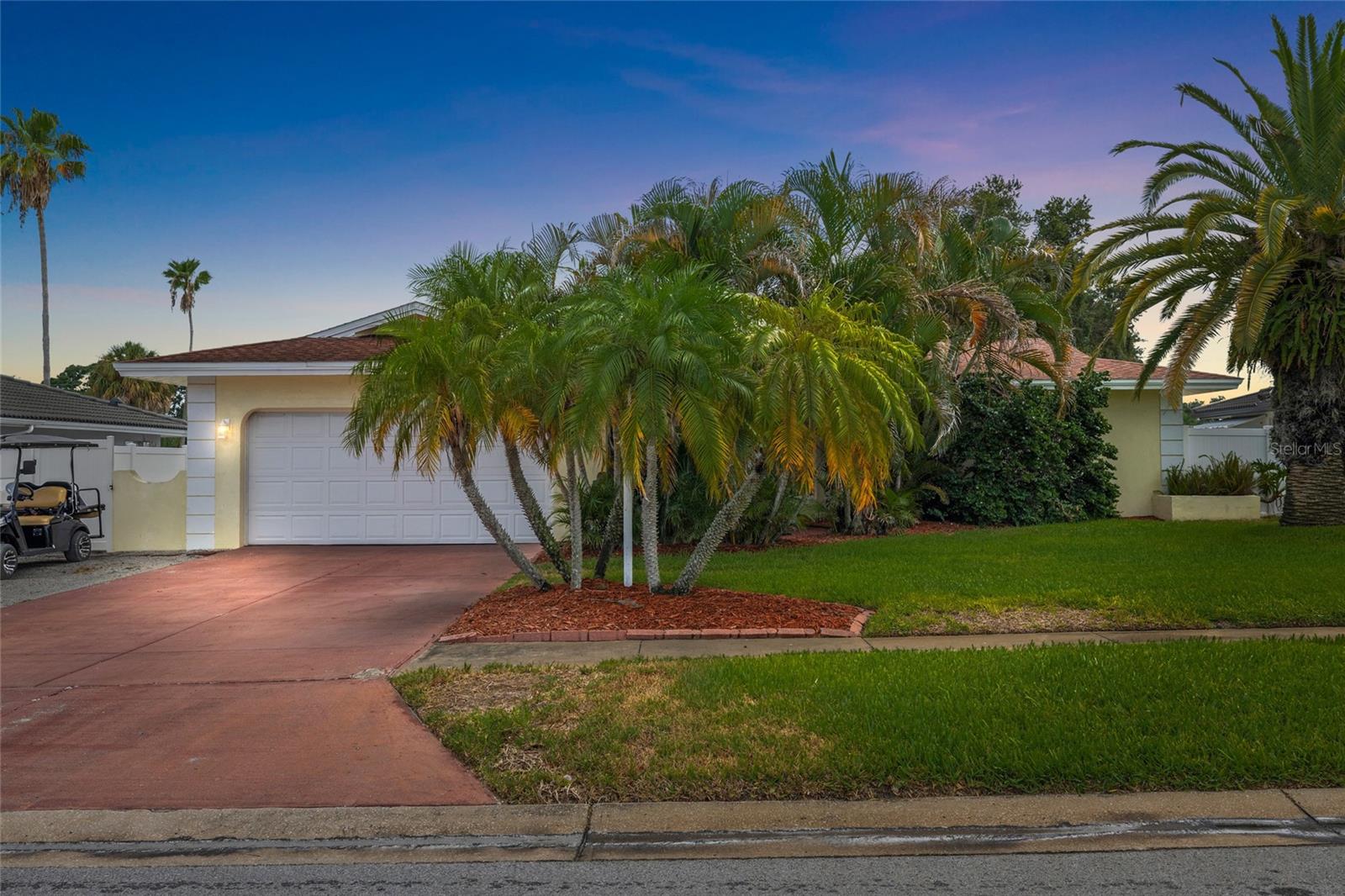 Welcome to the perfect blend of style, comfort, and location in one of Dunedin's most sought-after neighborhoods—Pinehurst Highlands! This beautifully renovated 3-bedroom, 2-bathroom pool home offers an ideal layout for Modern Florida Living. The stunning remodeled kitchen features elegant marble countertops, shaker cabinetry, stainless steel appliances, abundant storage, and a built-in office workspace overlooking the screened Rear Patio and sparkling pool. Designed with both everyday living and entertaining in mind, the home also offers a spacious living room, separate family room with a cozy wood-burning fireplace, and a dedicated dining area. The split-bedroom floor plan provides added privacy, with a generous primary suite featuring a walk-in closet and beautifully updated ensuite bathroom. Additional highlights include impact windows (2021), a remodeled kitchen with new appliances (2021), new blown attic insulation and AC Ducts (2025), new water heater (2025), updated electrical panel and shell parking pad for a 3rd vehicle, Boat, RV, etc. Located in a non-flood zone and within Dunedin's golf cart district, you'll enjoy direct access to nearly 100-acre Hammock Park at the end of the street and be just minutes from top-rated schools, vibrant downtown Dunedin, the Recreation and Aquatic Centers, Splash Park, Dunedin Golf Club, Highlander Park, the Pinellas Trail, baseball fields, tennis and pickleball courts, the Public Library, and TD Ballpark, home of Blue Jays Spring Training. Move-in ready and perfectly located—it's easy to see why homes in Pinehurst Highlands don't stay on the market for long!