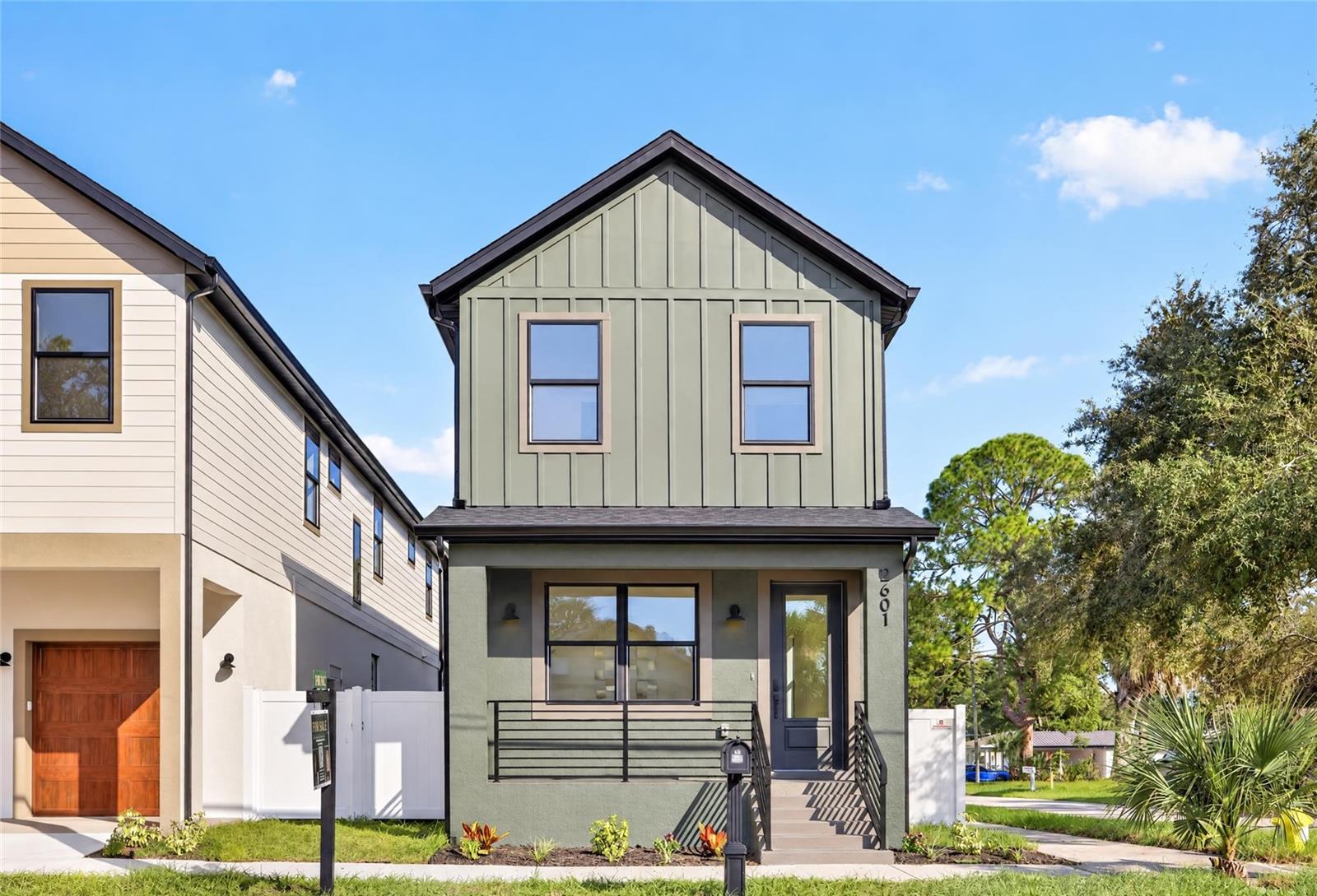 This 4-bedroom, 3.5-bathroom new construction delivers 2,164 square feet of thoughtfully finished living space on a slab foundation in Flood Zone X. Impact-rated windows and doors are throughout, and 9-foot 4-inch ceilings on both floors set an elevated tone carried through by luxury vinyl plank flooring, 8-foot interior doors, a premium glass staircase, and tray ceilings in the upstairs front and back bedrooms. The kitchen is built to perform: 42-inch cabinets with soft-close drawers and push-to-open doors, an island with custom white fluting, quartz countertops throughout the home, a workstation sink, custom vented range hood, Lumens pendant lighting, pantry, and Frigidaire appliances. Every bathroom features custom-built quartz vanities with soft-close undercount slides; the primary suite includes a glass-enclosed walk-in shower and a custom built-in closet, the secondary upstairs bath offers a tub and shower, the main-level ensuite has a glass-enclosed walk-in shower, and a half bath off the main living area is perfect for entertaining. Cat6 wiring to every room, a low-voltage panel, speaker pre-wire in the living room, and a front flex room round out a home built with intention from the foundation up. Backed by a 1-year whole-home warranty, 2-year MEP systems warranty, and a 10-year structural warranty. Located in West Tampa with quick access to everything that makes this city move: Downtown, the Riverwalk, Armature Works, Midtown, Raymond James Stadium, Hyde Park, Ybor, and Tampa International Airport all within minutes. The neighborhood sits near the emerging GasWorx district and the Rome Collective development, two of Tampa's most anticipated growth corridors, making this as much a bet on where the city is headed as where it stands today. Special financing available through a preferred lender: 6.125% fixed rate (6.208% APR), no monthly PMI, and a $10,000 grant toward down payment or closing costs for eligible buyers. Offer valid through November 30, 2026.