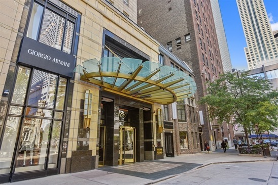 Welcome to Park Tower, where sophisticated condominium living meets the five-star services of the Park Hyatt. This stunning 2,052 sq. ft. residence offers 2 bedrooms plus a den and 2.5 baths in one of Chicago's most prestigious addresses. The open-concept kitchen is beautifully appointed with a large island, breakfast bar, granite counters, and premium appliances from Subzero and Gaggenau-perfect for everyday living or entertaining. Expansive floor-to-ceiling windows bathe the home in natural light, highlighting the spacious living and dining areas, rich hardwood flooring, and elegant fireplace. Custom millwork includes a built-in entertainment center, buffet, and wine cooler for seamless functionality. The luxurious primary suite features a walk-in closet plus two additional closets, and a spa-inspired bath with dual vanities, soaking tub, and separate shower. A second en-suite bedroom offers comfort and privacy for guests. Residents enjoy direct access to world-class Park Hyatt amenities: fitness center, indoor pool, Nomi Garden, and two private entrances. One garage space is included, and the sellers are generously covering the first year of Park Hyatt membership. Ideally situated along Michigan Avenue, you're moments from shopping, dining, cultural attractions, medical centers, and the lakefront.