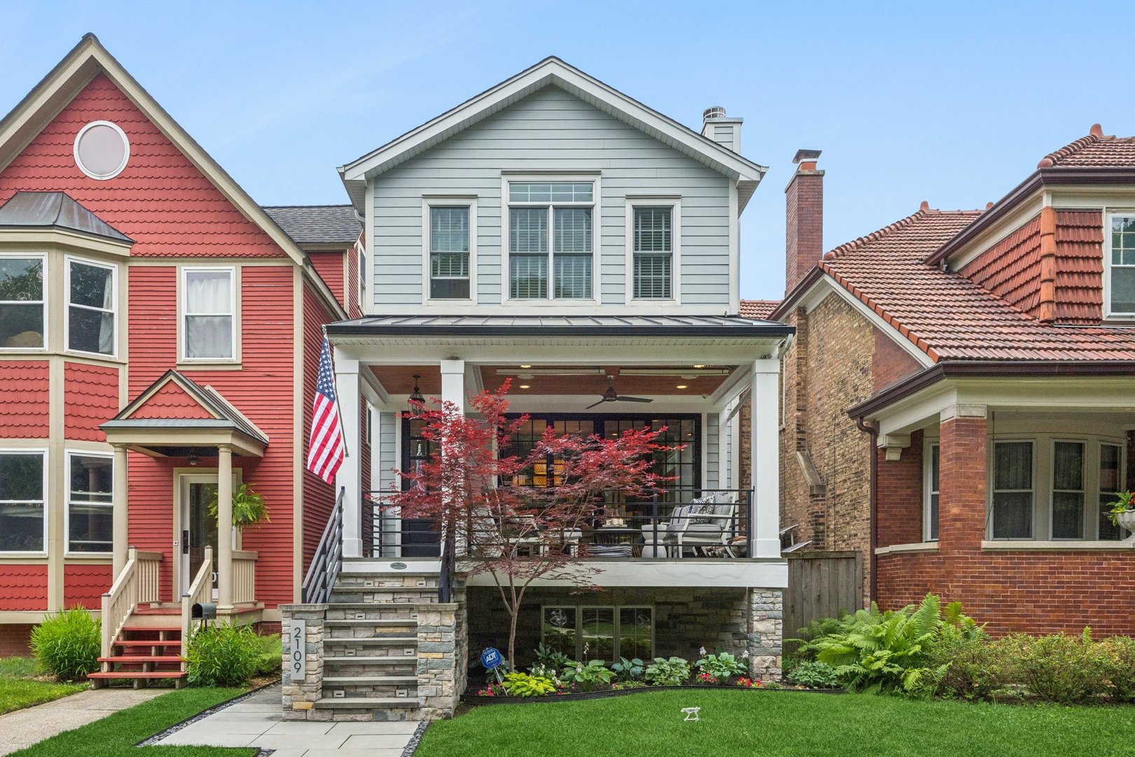 Custom-built 5BR/6BA home with nearly 4,000 sq ft across three finished levels in the heart of Lincoln Square. Renovated chef's kitchen features a butcher-block island, Wolf and Sub-Zero appliances, marble counters, and a walk-in butler's pantry that opens to a family room with a gas fireplace and built-ins. Three en-suite bedrooms up, including a primary with radiant-heated floors, a soaking tub, an oversized multi-head shower, dual vanities, and a walk-in closet. The finished lower level with radiant-heated floors adds a second family room with a wet bar, private guest suite, and a dedicated home office/bedroom. Three distinct outdoor living spaces: a heated covered front porch with radiant floors and overhead heaters, a backyard with a wood-burning fireplace, and a garage rooftop deck with a TV and room to dine. Large windows, abundant natural light, hardwood floors, custom millwork, and whole-home sound throughout. Steps to Lincoln Square's restaurants, cafes, shops, parks, and library.