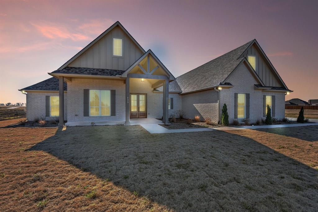 Elegant custom home in the newly developed, Lake Country Crossing subdivision.  You’ve found the one! This home has all the features a discerning buyer would appreciate & is centrally located near schools & nearby amenities – while also being just a short distance from beautiful Lake Texoma!  Inside you’ll find a spacious layout that is conducive to making your life easier!  From the attached laundry off the bedroom, to the split bedroom design, upstairs second living area all the way to the spacious, privacy fenced backyard – this home is a joy to live in!  While your new home is certainly a showstopper it’s the craftsmanship behind the walls, that differentiates this home from others.  Spray foam insulation throughout not only the home, but the attached 3 car garage.  40+ piers, with a minimum of 12” select fill to ensure your foundation stands the test of time. 20 seer HVAC unit is more efficient, green & saves you in utility costs! LED’s, custom cabinetry and so much more.