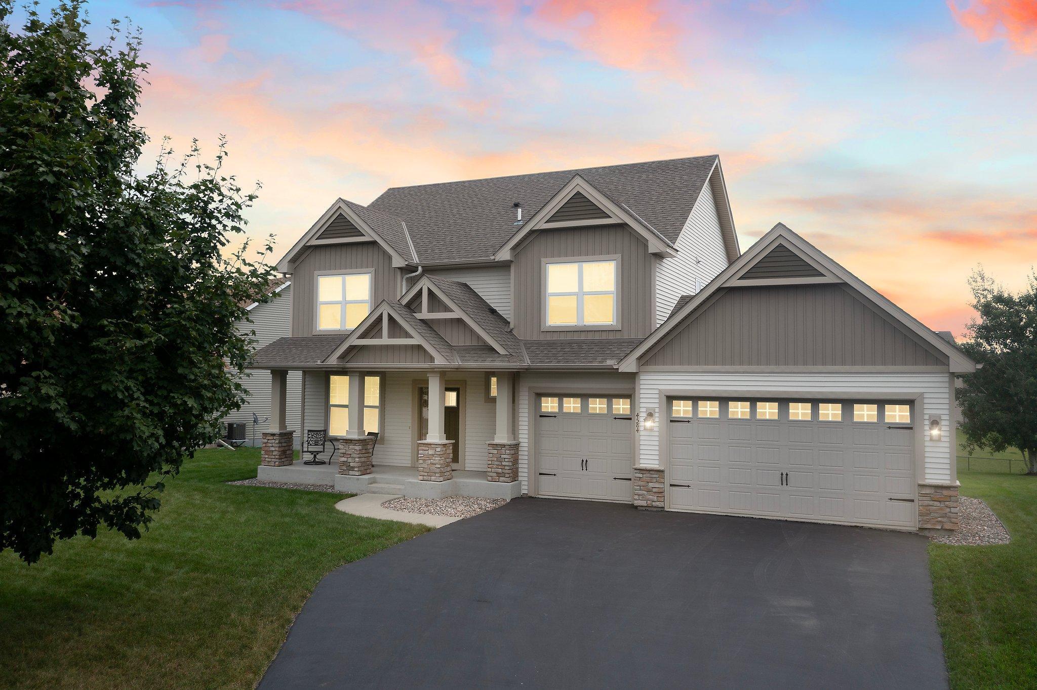 Nestled in a peaceful Minnetrista neighborhood, this beautifully maintained 4-bedroom, 4-bathroom home offers easy access to parks, sports courts, and the scenic Dakota biking and walking trail. It’s also just a short drive to Lake Waconia, The Winery at Sovereign Estate, and a variety of shopping and dining options.

This home has been meticulously cared for, and a  home inspection has already been completed—with over half of the noted items already addressed, providing added peace of mind for prospective buyers.

The kitchen is a chef’s dream, featuring abundant maple cabinetry, stainless steel appliances, engineered hardwood floors, a 4x4 pantry, and a center island with breakfast bar seating—ideal for casual dining. Adjacent to the kitchen, the bright and airy dining room provides easy access to a two-tiered deck, perfect for seamless indoor-outdoor entertaining.

The cozy main level living room boasts a gas fireplace with a tile surround and mantel, carpeting, a ceiling fan, and a large window that bathes the room in natural light. A front-facing den on the main level is perfect for a home office or extra living space, with large windows offering peaceful neighborhood views.

The upper-level primary bedroom is complete with a ceiling fan, a large window, and an en-suite bathroom with double vanities, an oversized tub, a walk-in shower, and a generous 9x5 walk-in closet. Three additional bedrooms on the upper level offer ample closet space and easy access to a shared full bathroom with double sinks and a tub/shower combo.

The upper-level laundry room includes a Whirlpool washer and dryer, wire shelving, and a drying rack for added convenience. The finished lower level, completed in 2022, features a spacious family room with recessed lighting, look-out windows, carpeting, and a wet bar, which is plumbed for a fridge if a future upgrade is desired. The convenient lower-level ¾ bathroom offers a spacious single vanity, a walk-in shower, and stylish patterned vinyl flooring.

The large, finished, and insulated 3-stall attached garage ensures year-round protection for your vehicles. Step outside to the expansive backyard, perfect for entertaining, featuring a maintenance-free 26x16 two-tiered deck.