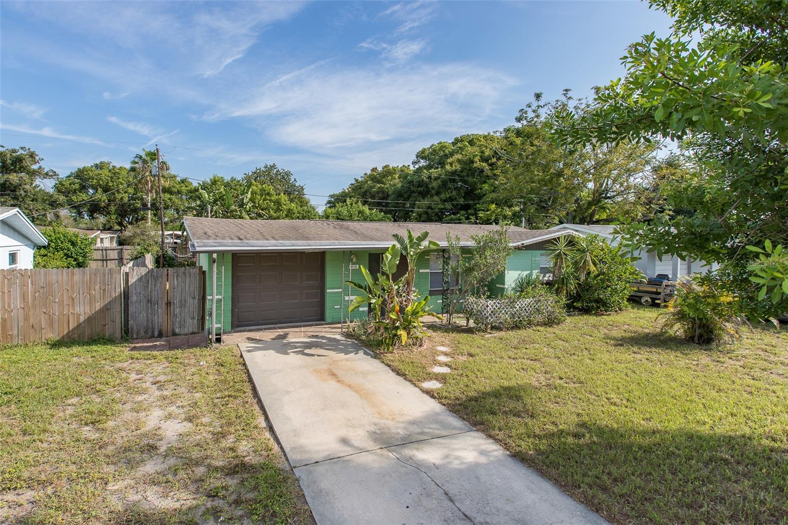This charming home lives large with its bright, open floor plan—perfect for entertaining family and friends. The sunny kitchen offers plenty of cabinet space and an island counter ideal for meal prep or casual dining. Both bedrooms are comfortably sized, and the layout flows beautifully throughout. Step outside to a spacious, fully fenced backyard with plenty of room for kids or pets to play. A brand-new septic system was installed this year, giving you peace of mind for years to come. With just a touch of TLC and cleanup, this home could truly shine!
Don’t wait—schedule your showing today and make this delightful home yours!