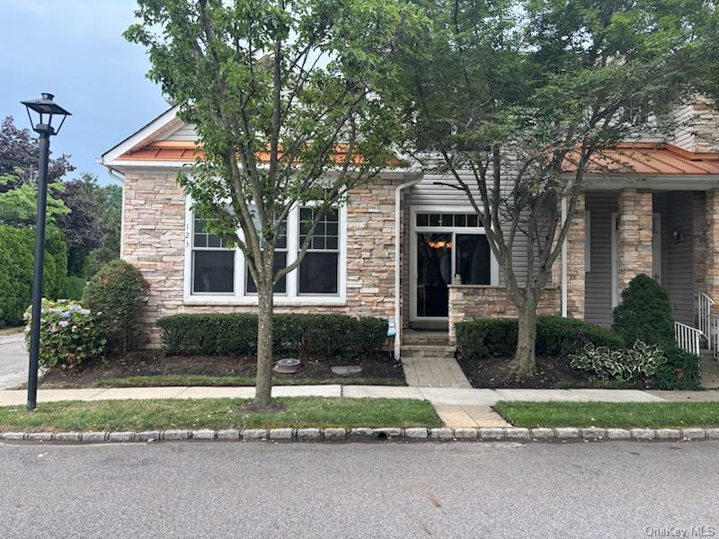 Welcome to this beautifully maintained 3-bedroom, 2.5-bath condominium in the sought after Harbor View community in Port Washington. Thoughtfully designed for comfortable living, this home offers a spacious and inviting layout with abundant natural light throughout.  The bright eat-in kitchen features a cozy breakfast area, and sliding glass doors that opens to a private outdoor sitting space-perfect for enjoying your morning coffee or relaxing with a good book.  The first floor boasts an open-concept living and dining area, creating an ideal setting for both everyday living and entertaining.  A centrally located staircase leading to the second level, where you'll find two generously sized bedrooms, a versatile office or loft area, and a full bath that provides comfortable accommodations for family and guests.  Conveniently located on the main level, the primary suite, offers two spacious walk-in closets and a luxurious en-suite bathroom complete with a soaking tub, separate shower, and ample space to unwind.  Enjoy the exceptional lifestyle Harbor View offers, with beautifully maintained grounds with luxury amenities, walking distance to the Harbor Links golf course and Bar Beach.  Port Washington is a prime location close to LIRR, shopping, dining, parks and all that North Shore has to offer.