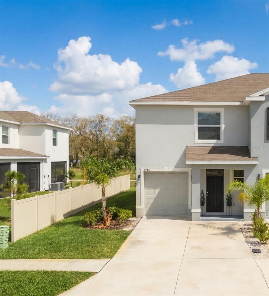 COME AND SEE THIS BEAUTIFUL and modern upgraded concrete block 3-bedrooms 2.5 bathrooms townhouse with a loft and a one car garage townhome located in the Union Park community in Wesley Chapel. Located in highly rated school zone, walking distance to Union Park Charter Academy. The property offers an open floor plan, smart home features, a one-car garage, and access to resort-style amenities, making it attractive for first-time buyers, families, or investors seeking rental income. The master bedroom includes an en- suite with double vanity and 2 walk in closets, one of which has upgraded custom shelving and drawer system. On the second floor you will also have 2 additional bedrooms, an additional bathroom, bonus room/loft and the laundry.  Spectrum cable, high speed internet, exterior maintenance is included with the HOA. Amenities in Union Park include basketball courts, lap pool, resort style swimming pool, gym, trails, splash pad, dog park, and playground.Conveniently located near Wiregrass Mall, Tampa Premium Outlets, AdventHealth Wesley Chapel hospital, SR-56 and I-75 for commuting to Tampa.