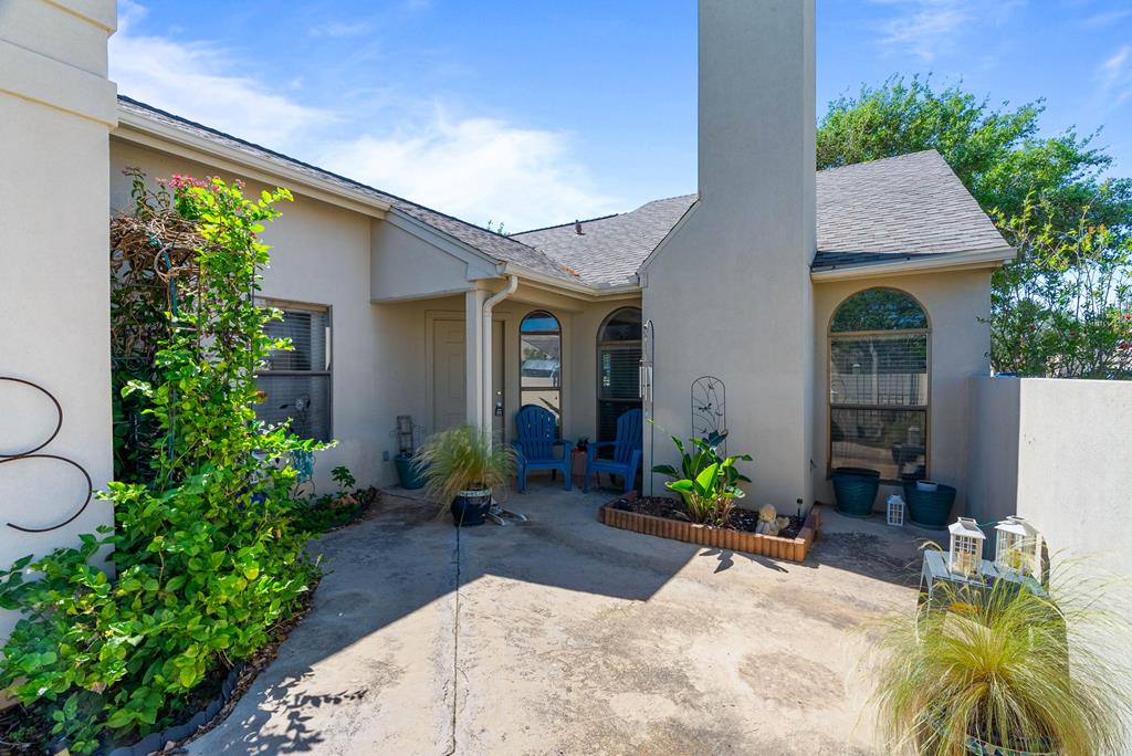 Experience refined coastal living in this beautifully appointed 2-bedroom, 2-bath townhouse in the gated community of Country Club Square in Rockport, Texas. Offering 1,258 square feet of thoughtfully designed space, this home blends comfort, style, and effortless elegance. The open-concept layout is filled with natural light and enhanced by soft coastal tones, creating a serene, airy ambiance. The spacious kitchen flows seamlessly into the living and dining areas, where a cozy fireplace adds warmth and charm. Just off the kitchen, a well-placed laundry area features a back door leading to the backyard space for added convenience. Both bedrooms are generously sized, with well-appointed bathrooms. Step outside to your private gated courtyard&mdash;an inviting retreat perfect for morning coffee or evening gatherings. A 2-car garage completes the package. Enjoy low-maintenance, upscale coastal living in one of Rockport's most desirable gated communities.