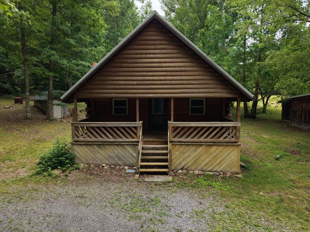 Tucked away in the rolling hills of Smyth County, this 2-bedroom, 2-bathroom cabin offers the rare combination of true seclusion and everyday convenience — just a short 15-minute drive to the shops, restaurants, and amenities of Chilhowie or Marion. Set on 6.33 stunning acres of wooded Appalachian land, this property is a nature lover's dream. Whether you're an avid hunter, weekend hiker, or simply someone who values peace and privacy, the mature timber and abundant wildlife surrounding this cabin deliver it in full. Wake up to birdsong, watch deer cross the property at dusk, and fall asleep to the quiet that only the Virginia mountains can offer. Inside, the cabin balances its warm, rustic character with the modern conveniences that matter most — including a heat pump for year-round comfort. It's a home that feels like a retreat without asking you to rough it. Outside, the possibilities are wide open. The acreage offers ample room for large gardens, small-scale homesteading, or simply spreading out. Several outbuildings and barns add valuable storage and working space, and the property's well and septic system support a lifestyle that's as self-sufficient as you want it to be. A standout feature is the side lot — complete with its own separate septic system, previously used to host a semi-permanent mobile home. It could be used for an RV hookup, a second home site, or multi-generational living. This is mountain living at its finest.