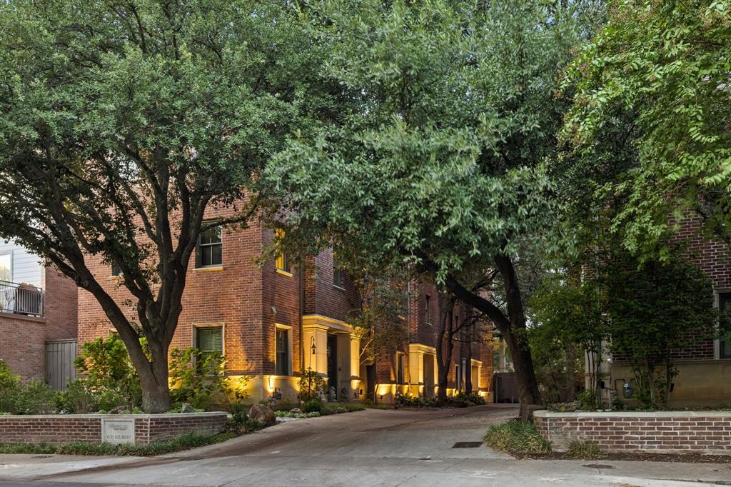 A rare offering in the coveted Brownstones of Oaklawn, this exceptional three bedrooms residence pairs sophisticated urban living with the comfort and scale of a true home, crowned by sweeping views of the Dallas skyline. Set beneath a canopy of mature trees, this beautifully positioned community offers an enviable lock-and-leave lifestyle within effortless reach of The Shops at Highland Park, the Katy Trail, Turtle Creek Park, Highland Park Village and the Knox Street corridor. Walkability to morning coffee at Merit, Equinox, Al Biernat's & Norman's, just to name a few. Spanning more than 2,700 square feet, the thoughtfully designed floor plan offers an uncommon sense of space and privacy. Two generously sized bedrooms are privately positioned on the first level, while the second level serves as the heart of the home with an inviting kitchen, dining and living spaces, plus a dedicated office. The entire third level is devoted to a serene primary retreat, creating a private oasis complete two closets, built-ins, a balcony and laundry. Above it all, a turfed rooftop terrace provides an extraordinary setting for sunrise coffee, sunset cocktails, grilling or entertaining beneath the Dallas skyline. Every level is designed to maximize both livability and privacy, offering the rare combination of generous proportions and effortless everyday functionality. Ideally located in the heart of it all, yet minutes from Love Field for convenient travel, this exceptional residence delivers the best of Dallas city living—a sophisticated urban address with the space, privacy and feeling of home.