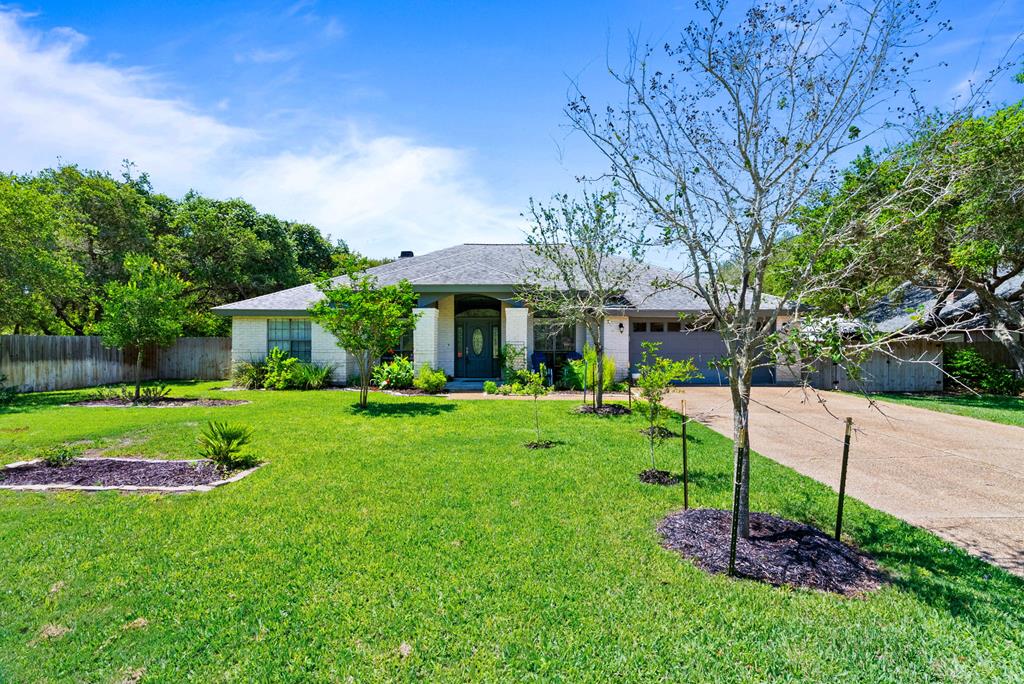 Welcome to 112 Poquito, a beautifully remodeled home nestled in the highly sought-after Spanish Woods subdivision. Situated on just over one-third of an acre, this thoughtfully updated residence offers both functionality and style, with room to spread out and enjoy the coastal lifestyle. Step inside to discover a spacious open floor plan that seamlessly connects the large living area, breakfast nook, and a modernized kitchen, perfect for entertaining or relaxed daily living. The kitchen features contemporary finishes, ample counter space, and plenty of storage—ideal for any home chef. In addition to the open living spaces, the home includes a formal dining room for gatherings and a dedicated office or study, offering flexibility for remote work, hobbies, or a quiet retreat. On one side of the home, you'll find three comfortable guest bedrooms and two full bathrooms, each tastefully finished. The added barn door creates a mother-in-law quarter so that guests have complete privacy. On the opposite wing, the spacious primary suite serves as a private oasis with a large walk-in closet, and a well-appointed ensuite bath featuring both a soaking tub and a separate walk-in shower. A completely remodeled laundry room also boasts a drop zone. Step outside to your expansive backyard, complete with a thriving garden and plenty of space to relax or entertain. Whether you're enjoying a sunny afternoon, planning your next outdoor project, or simply taking in the peace and quiet, the outdoor space has something for everyone. There's also ample room to park your RV, making this home ideal for adventurers. The attached garage offers excellent storage solutions and is perfect for tinkering, tools, or weekend projects. Located in the heart of Rockport's desirable Spanish Woods neighborhood, this move-in-ready home combines comfort, charm, and versatility all in one. Located on a dead end street, so no through traffic. There's a 30amp RV outlet, too!