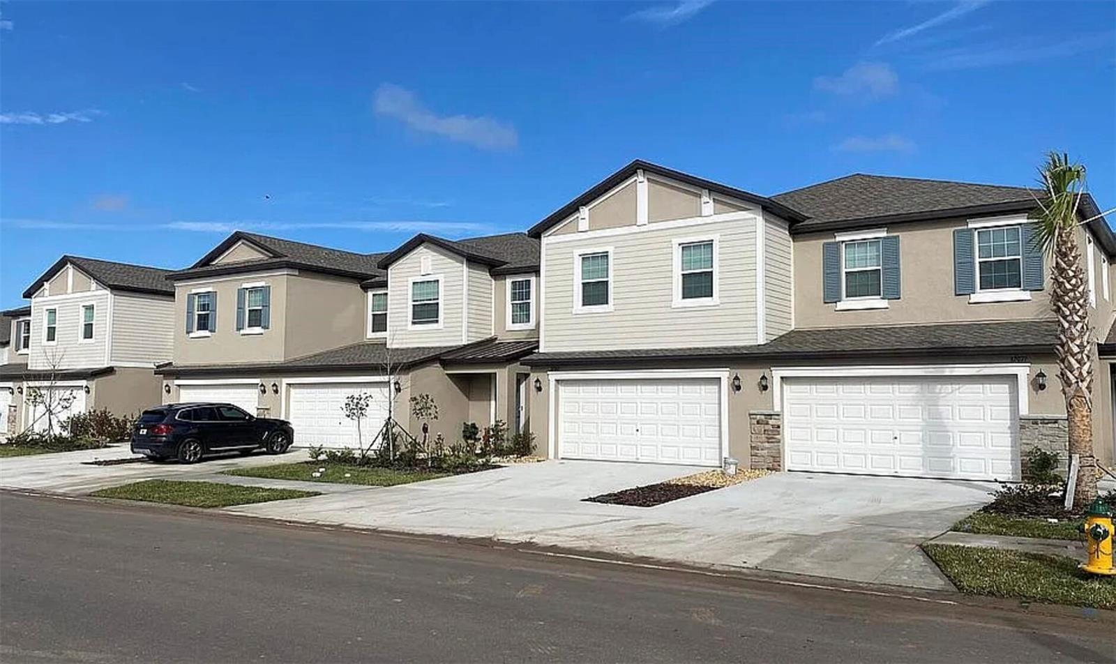 NO REAR NEIGHBORS. The covered patio of this 2024 townhome looks out over open space instead of another building - a rare lot in Mirada, home of the 15-acre crystal lagoon. Vacant and move-in ready: 3 bedrooms, 2.5 baths, 1,634 sq ft and a 1-car garage, with no construction wait and no builder lot premium. The open main floor features a kitchen with granite countertops, stainless steel appliances and a breakfast bar, tile flooring throughout, and a half bath. Upstairs you will find a flexible loft for an office or media room, the owner's suite with walk-in closet and private bath, two additional bedrooms, a second full bath and the laundry. Keyless entry, LED lighting and ceiling fans throughout. Residents enjoy the lagoon with sandy beaches, swimming and paddleboarding, and the HOA covers lawn care and high-speed internet/cable. A Publix is inside the community, with I-75 and SR-52, Wesley Chapel, The Shops at Wiregrass and Tampa Premium Outlets a short drive away. Some photos are virtually staged.