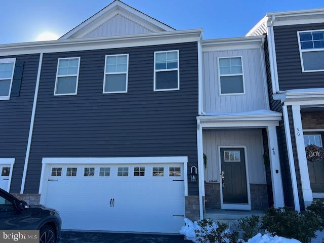 Beautiful newer construction offering a full finished basement in the lovely neighborhood of Medford Walk. Home has a large deck facing open Farmland offering gorgeous sunsets nightly. Open Foyer with high ceilings and half bath. Enter into open floor plan with LVP flooring and high-hat lights throughout. Chef's kitchen with large pantry and solid surface countertops, S.S gas stove, dishwasher, microwave and custom refrigerator. Upstairs you will find 4 large bedrooms 2 full bathrooms and a walk in laundry room. The finished basement offers added living space or a playroom for the kids. Additional storage room for seasonal items. 2 car attached garage with EV charging station. Make this home your today