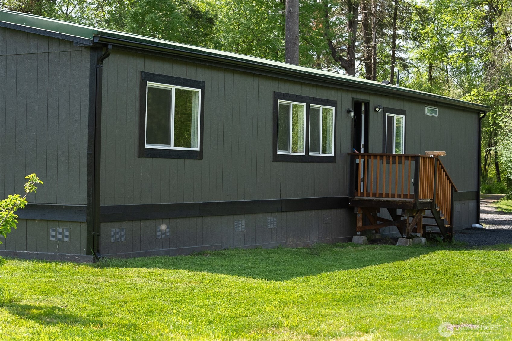 This shy 10-acre property spanning two parcels offers a rare combination of privacy, functionality, and natural beauty. Tucked into an exceptionally peaceful setting at the end of a county road, surrounded by hundreds of acres of forest, the property offers a secluded feel, yet is conveniently located just minutes from I-5 and the town of Toledo. The bright and airy 1,620 sq ft manufactured home features 3 bedrooms and 2 bathrooms, large closets, abundant natural light, beautiful wood cabinetry, fresh paint, thoughtful updates, and comfortable living spaces that feel welcoming year-round. A new deck off the slider opens to an inviting outdoor area complete with a fire pit and seating space, ideal for enjoying the surroundings. The property includes a mix of native and owner-planted trees including cedar, fir, fruit, and nut varieties. Second parcel may offer future homesite potential, investment possibilities, or added flexibility for future use (buyer to verify). Fast and reliable fiber optic internet. Several outbuildings provide storage, workspace, or room for hobbies and projects. A versatile property with plenty of opportunity to make it your own.