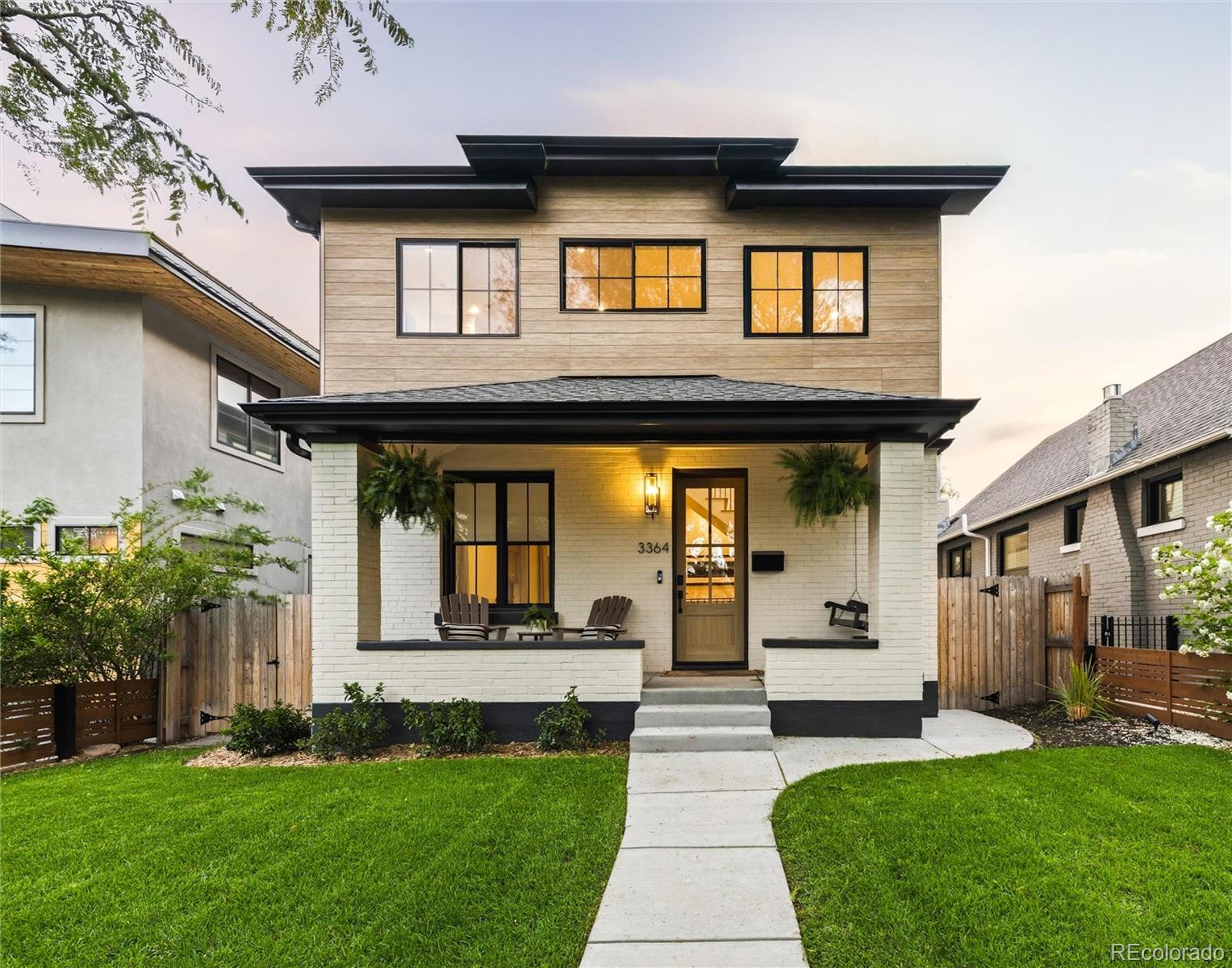 Nestled in one of Denver’s most coveted neighborhoods, just a block from Highlands Square, 3364 W Moncrieff Place perfectly balances modern comfort, timeless charm, and unbeatable city access.This thoughtfully updated home is filled with features designed to elevate daily living. Natural light pours through the Marvin windows, illuminating engineered hardwood floors, while the kitchen impresses with handcrafted custom cabinets, a spacious island, JennAir appliances, and a cleverly designed pantry to keep everything organized. The floor-to-ceiling glass wall is a fully operable window wall that seamlessly blurs the lines between indoor and outdoor spaces, creating an inviting flow. Outside, enjoy evenings by the natural gas fire pit, watch movies on the drop-down screen, or relax under Italian and bistro lights in the beautifully landscaped yard that includes a full an irrigation system, and dreamy outdoor lighting. Don't miss the garage with EV charging and room to store all your gear, including extra attic space. The home’s smart design continues inside with 9-foot ceilings, a cozy downstairs wet bar, soundproof kids’ rooms with creative nooks, and a flexible upstairs office with two extra bedrooms. Tech lovers will appreciate smart thermostats, Wi-Fi pucks, a robust ADT security system, and a commercial low-voltage setup. Practical features like a tankless water heater, whole-house water filtration, radon mitigation, and Class 4 shingles ensure comfort and efficiency.Additional highlights include a luxurious steam shower in the primary suite, a split HVAC system for energy savings, towel drying rack, flagstone pavers out front, and even EV charging capabilities out front. This home has it all, from the built-in robot vacuum garage to the modern conveniences throughout, you cannot go wrong. Watch the video tour here: https://www.youtube.com/watch?v=12xIUZ4ttkc Make 3364 W Moncrieff Place yours—schedule a private tour today!