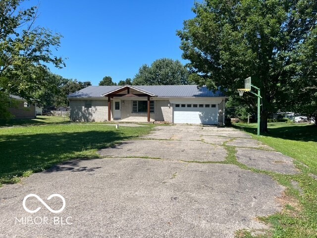 Discover the inviting charm of 12609 Markay DR, Fishers, IN, USA. This 1964 ranch-style single-family residence, encompassing 1464 square feet on the main level and a finished basement is ready for you to move in and begin your next chapter.  The heart of this home features a G-shaped kitchen, thoughtfully designed with a peninsula for casual dining or entertaining, and equipped with sleek stainless steel appliances, ensuring both style and functionality.  The bathrooms offer modern comfort, with at least one featuring a convenient walk-in shower for a spa-like experience.  Beyond the interiors, the expansive 22,651 square foot lot provides ample space for outdoor enjoyment, including a cozy fire pit perfect for gatherings under the stars. An attached garage offers practical storage and parking solutions, while a welcoming porch provides a lovely spot for relaxation.  This home presents a unique opportunity to embrace comfortable living in a desirable location.