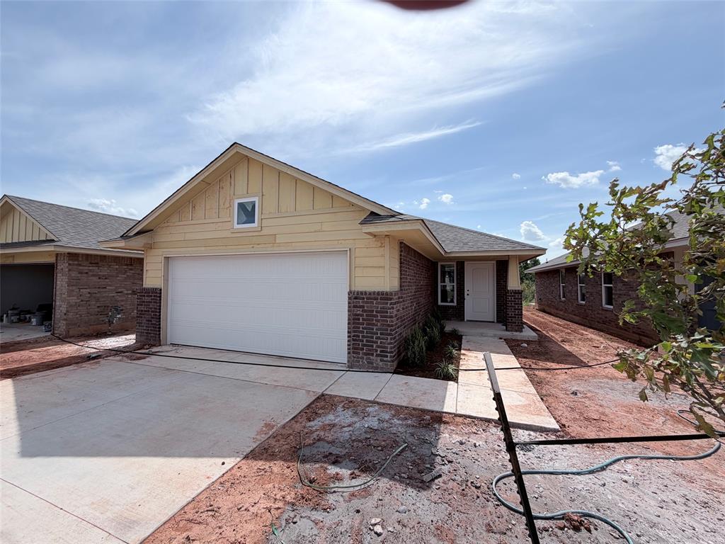 This beautiful new home has the perfect layout for both entertaining and daily living. You will love the stunning wood tile that flows throughout all of the main areas, tying the living, kitchen and dining together seamlessly. The kitchen features custom cabinets, a large centered island with deep sink, stainless steel Samsung appliances and much more. The home is flooded with natural light from the abundance of windows in the living room and dining area, giving a homey feel. The primary bedroom is very spacious and the en suite has a luxurious floor to ceiling roomy tiled shower that will make you feel pampered. Both spare bedrooms are situated near the guest full bath and linen closet for convenience. This home is very energy efficient and even has a handy EV charger in the finished garage. Come and check out this home while it is still available!