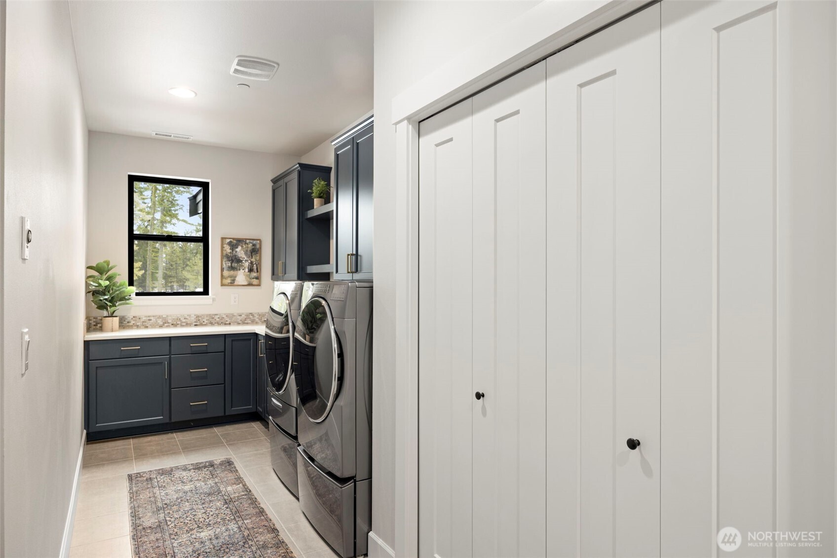 A convenient mudroom entry from the garage leads directly into the laundry room, offering plenty of additional storage and closet space to keep all your mountain gear organized and tucked away.