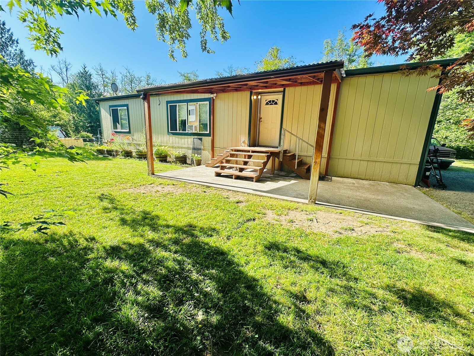 Discover your dream home near Skagit County Speedway, just 5 minutes from the freeway for easy access! This 3-bedroom, 2- bathroom home sits on just under 5 acres of serene land, offering space and tranquility. Enjoy the different variations of fruit trees and blueberry bushes, a partially fenced yard perfect for pets or gardening, and a spacious garage with two sheds for storage. Ideal for race fans and those craving a peaceful retreat with modern conveniences nearby.