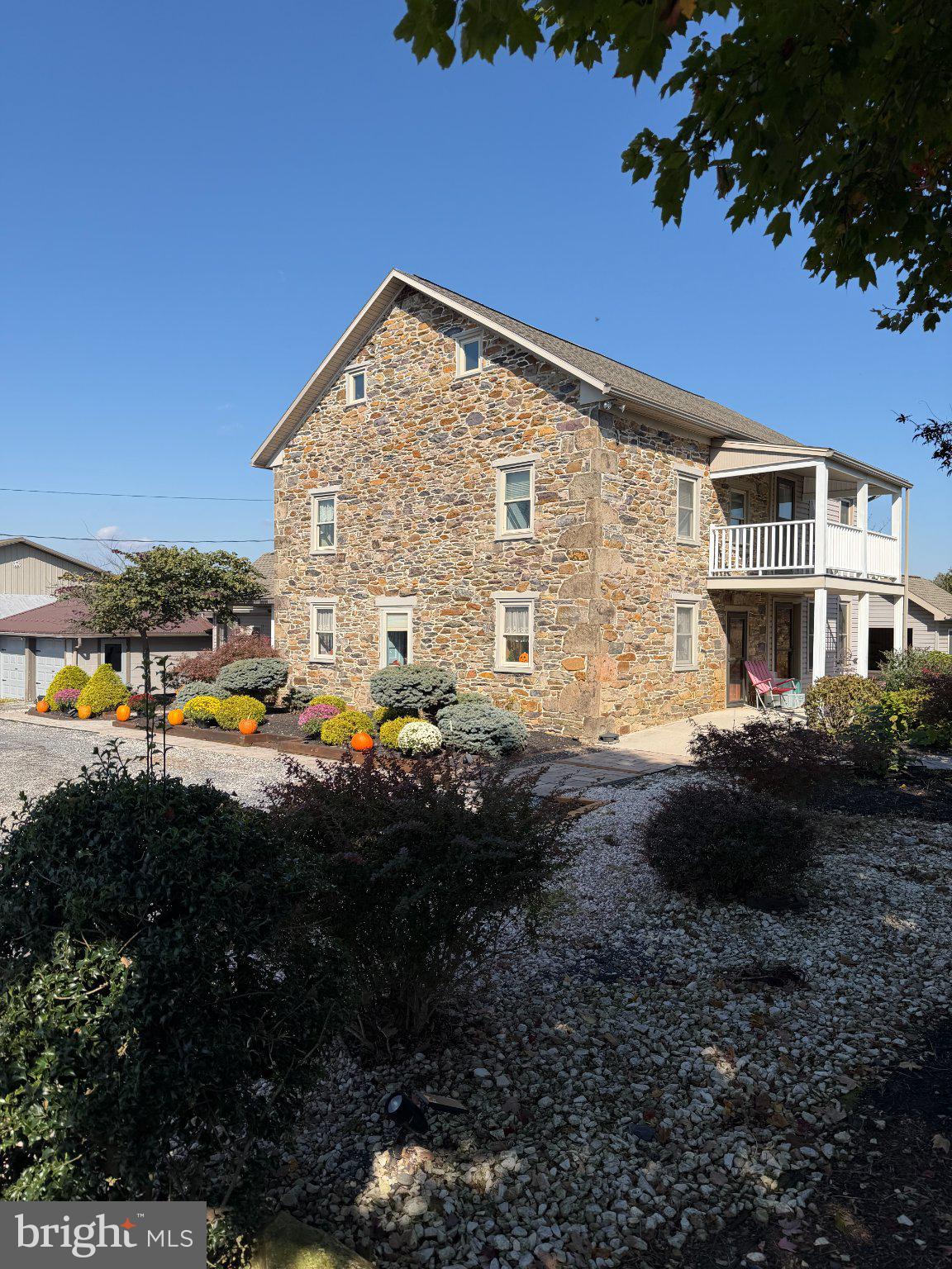 Discover the beauty, history, and possibilities of this remarkable 89+/- acre country property. Featuring approximately 2,340 sq. ft. of living space, this 3-bedroom, 1.5-bath home has a rich history, with the original portion dating back to the 1700s. The property offers approximately 71.58 acres of pasture/cropland and 17.41 acres of wooded land, providing opportunities for farming, recreation, hunting, and enjoying the great outdoors. Two scenic streams wind through the property, while beautiful mountain views create a picturesque country setting. The 50' x 80' two-story barn. Additional outbuildings include a 38' x 42' heated and insulated Morton building with overhang, electricity, and water, plus a two-car detached garage with abundant storage and a two-car attached garage. Enjoy two covered porches, numerous gardens, a fire pit, patio pavers, and a separate hot tub house. A historic 38-inch hand-dug well, unused for many years, adds another unique piece of the property's story. Wildlife enthusiasts will appreciate the deer that frequent the land, including trophy-sized deer. Whether you're dreaming of a hobby farm, hunting retreat, country homestead, or a property rich in history and natural beauty, this unique offering presents a rare opportunity to make your own piece of the countryside yours!