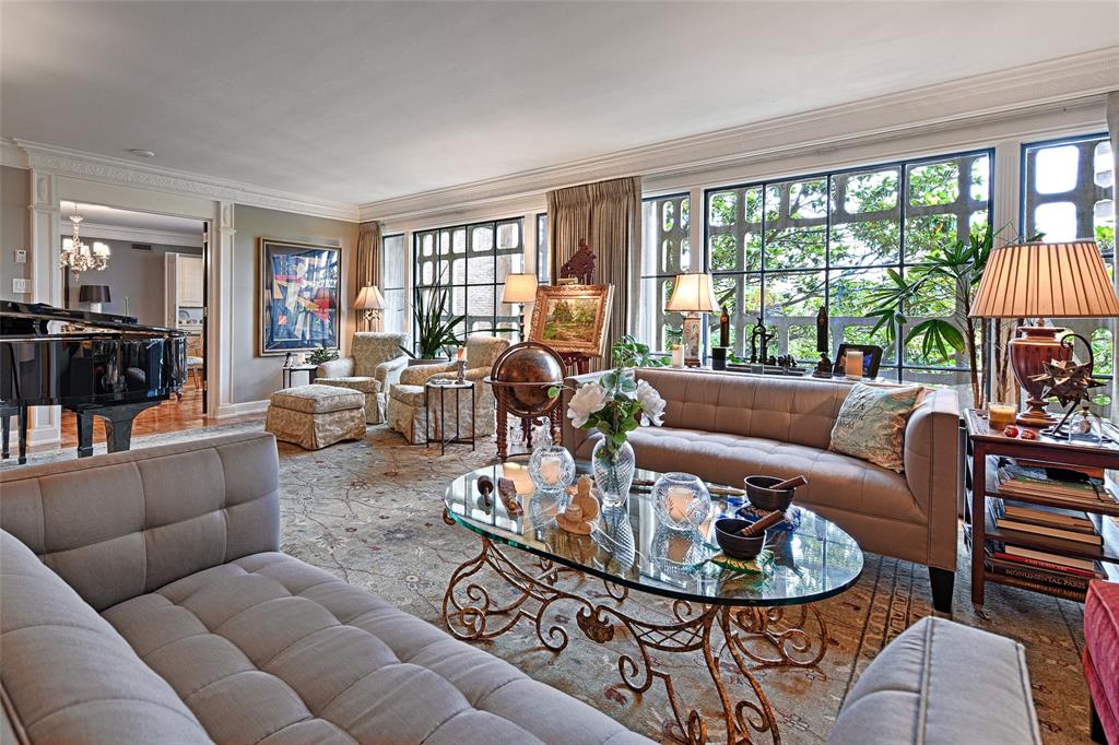 Living area featuring crown molding and wood finished floors