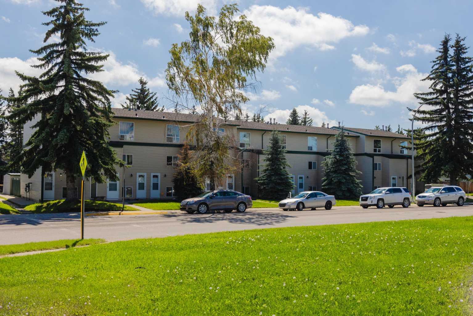 This beautifully updated Westmount Place condo is extensively renovated and 100% MOVE-IN READY! Fresh paint, new flooring, remodelled bathroom, modern cabinet doors, and upgraded appliances are highlights adding both beauty and function. Each bedroom is designed for true comfort, complete with new built-in wardrobes offering generous storage and blackout blinds for restful nights. The unit also has its own furnace, hot water heater, and in-suite laundry to maximize your convenience. Another standout feature is the remarkable quietness that allows you to truly relax. Outside, a dedicated carport keeps your vehicle protected year-round, while your private and secured on-site storage room offers plenty of space for seasonal items, bikes, and sporting gear. The very reasonable condo fees make your life easier by covering nearly everything except electricity and internet! Being located in a quiet, family-friendly neighborhood with a park right across the street, close to schools, walking paths, and lakes, plus the easy commute to Calgary, this home is ideal for first-time buyers, downsizers, or investors. Make this MOVE-IN READY home yours before someone else does!
