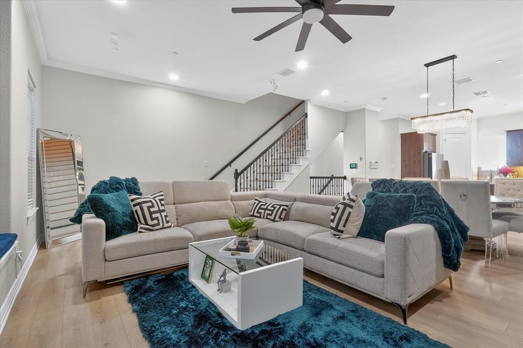 LOCATION, LOCATION, LOCATION! Experience vibrant, low-maintenance living in this beautiful UPDATED three-story townhome located in the HEART of highly sought-after FRISCO SQUARE. Enjoy the ultimate WALKABLE LIFESTYLE just steps from FC Dallas SOCCER Stadium, Downtown Frisco events, live music, festivals, restaurants, bars, movies, shopping, medical center, the Public Library and minutes from the UPCOMING city game changers 40 million 1000 acre GRAND PARK and Universal Studio Kids Resort. This home is very well kept and thoughtfully laid-out home features all Luxury VP Wood Oak flooring, solid wood 8ft doors on every level, beautiful crown moulding with matching baseboards on every level. The third floor features your OVERSIZED PRIMARY suite 20x18 with a SITTING AREA, no carpet in bedroom, Bathroom ensuite has updated tile flooring, HIS AND HER walk-in closets, DUAL vanities, tons of storage, separate toilet room with more upper cabinets, lux standalone shower and tub and a conveniently located FULL LAUNDRY room with SINK and upper CABINETS. The second level showcases an OPEN CONCEPT, kitchen with SS appliances, real oakwood custom cabinets, dining, and living area, bay windows with window seat perfect for ENTERTAINING and EVERYDAY LIVING. On the first level, you’ll find a VERSATILE second bedroom OR office with its own ensuite bath ideal for guests and or work from home. NO CARPET. Live where convenience meets lifestyle and a RARE Primary or Secondary home investment opportunity in Frisco Square! LOW HOA, LOW TAXES, NO MUD, OR PID TAX.