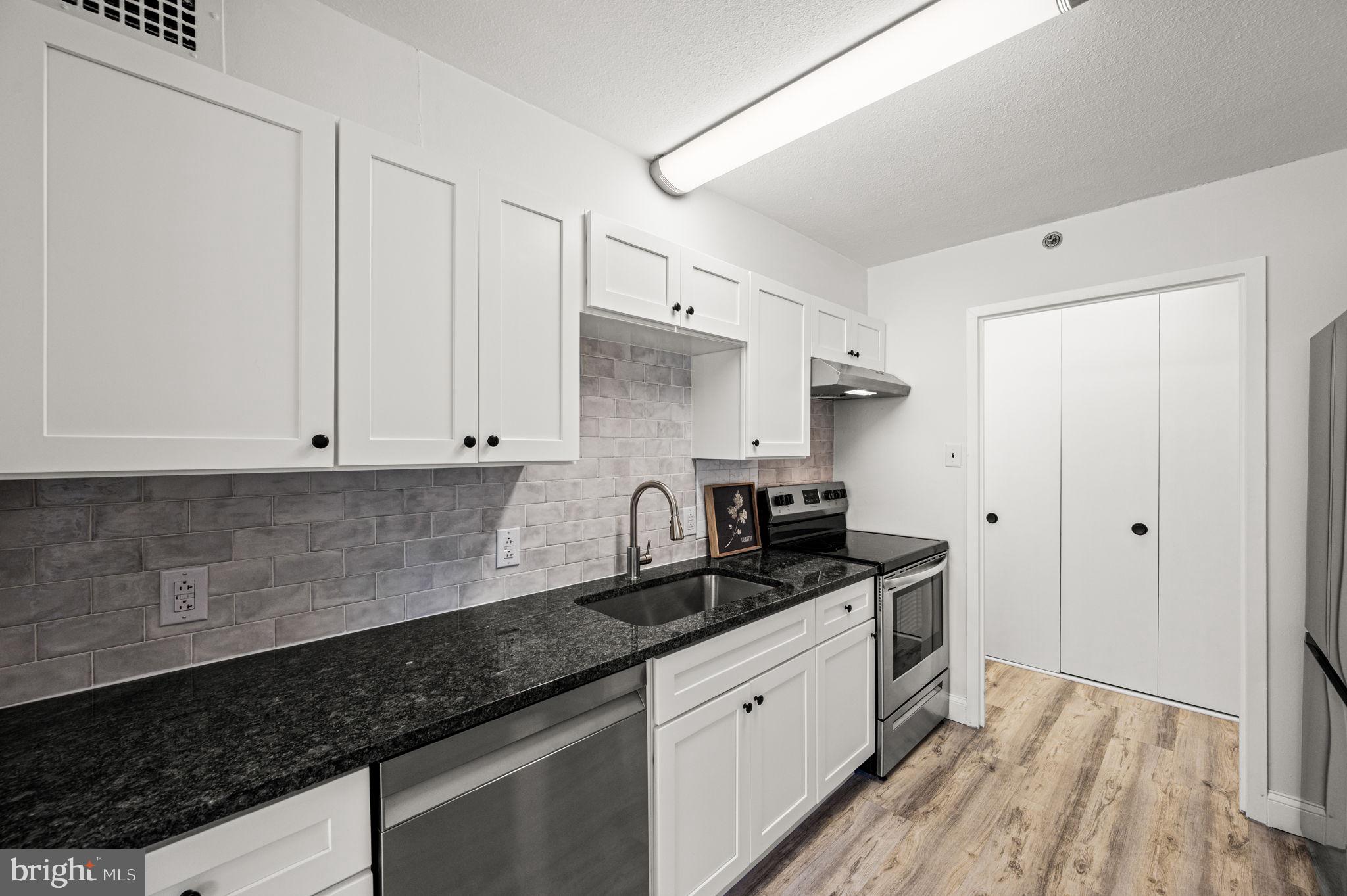 Move right into this beautifully updated home in the west building featuring a new kitchen with stainless steel appliances, tile backsplash and granite countertops - perfect for both everyday living and entertainment. Fresh interior paint and new flooring throughout the entry, living room, dining area and both bedrooms create a clean, modern aesthetic. Thoughtful lighting upgrades include a new dining area chandelier, living room track lighting, and an overhead kitchen light, enhancing both style and functionality. The two spacious bedrooms feature new ceiling fans, a walk-in closet with shelving in one bedroom and two separate closet areas in the other. Additional value-added features include new ceilings in both full bathrooms, an upgraded electrical panel, and interior sprinkler system. Step outside from the dining area to a private patio—ideal for relaxing or outdoor dining. A laundry closet with a new washer and ventless dryer adds for everyday convenience. HOA fees include electricity, heat, air conditioning, hot and cold water, a security guard at the vehicle entrance, and 24/7 doorman. Residents also enjoy access to tennis courts, playground, game room, library and shuttle bus to local shopping, the train station and Lankenau Medical Center. Situated on a beautifully landscaped 23-acre property, the community offers outdoor and indoor pools, cabanas, parking garage, electric car charging station, fitness center, social club and storage locker (additional fees apply). It’s like a vacation right at your front door! Located in the highly sought-after Lower Merion School District, the community is adjacent to Friends Central School and just a half mile north of the Kaiserman JCC. Wynnewood Shopping Center and Whole Foods are 1.5 miles west, while Trader Joe’s and the boutiques of Suburban Square are 2 miles west. City Avenue Shopping Center is less than 1 mile south. Center City Philadelphia is an easy 25-minute drive or take advantage of the Overbrook SEPTA R5 train station less than a half mile north for effortless commuting. This location is also ideal for professionals working at Lankenau Medical Center, located just around the corner. An exceptional value in an unbeatable location—don’t miss this opportunity!