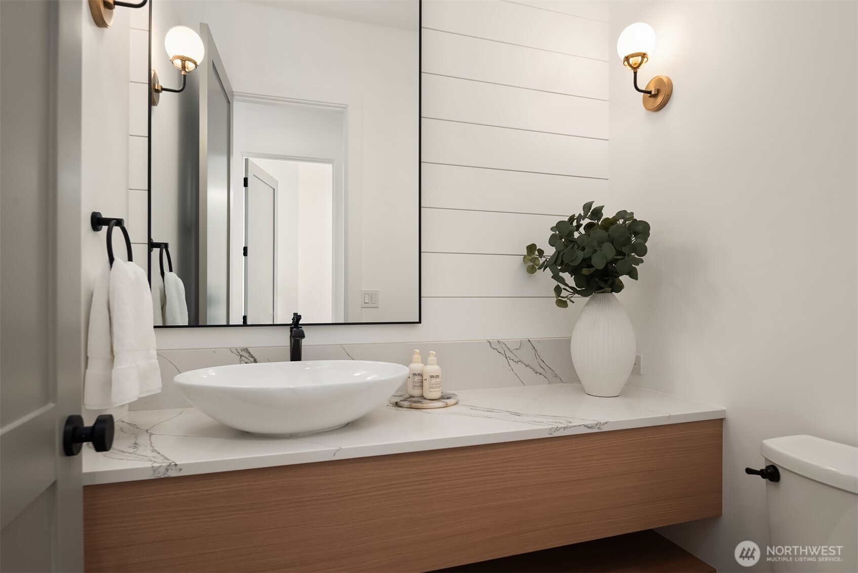 Powder bath with vessel sink and shiplap accent wall