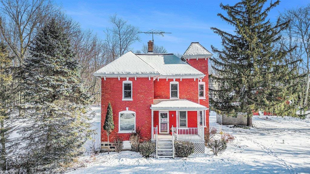 Step into this stunning Victorian farmhouse, where historic character meets serene country living on over 40 acres. The home features beautiful handcrafted molding throughout, a first-floor bedroom, convenient first-floor laundry, and a newer furnace for added comfort. Upstairs, you will find 3 bedrooms along with a full bath. The home has a walkable Michigan basement offering additional storage space. Another added bonus is that you have a walk up attic ready for your finishing touches! Enjoy peaceful views from the spacious deck overlooking the rain-fed pond.  You will find abundant wildlife, and many trails right on your property. The two-story pole barn provides storage or a hobby space, perfect for farming, recreation, or workshop needs. There is also a cinderblock outbuilding on the property!  The Generac generator is included as well! This unique property blends timeless craftsmanship with practical modern updates for truly effortless country living.