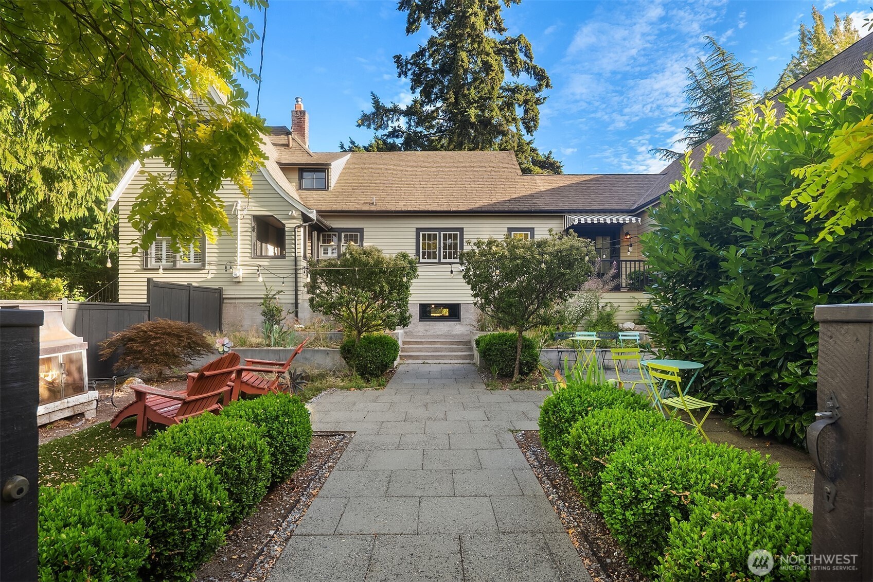 10k Buyer Bonus for offer submitted prior to 9/1. Move-in ready and thoughtfully updated, this 4-bedroom, 3-bath Edmonds residence offers the perfect blend of classic charm and modern living. A fully fenced front yard creates a private oasis with mature, low-maintenance landscaping and stone pavers, while the spacious double French door entry provides a warm welcome for guests.  Inside, refinished original hardwood floors, wainscoting, wood shutters, fresh interior paint, and a stunning new kitchen with gas cooking and an eating area create an inviting atmosphere. The circular main-floor layout offers effortless flow and includes the primary bedroom, powder room, living room, dining room, and a well-appointed utility room with smart storage and a utility sink.  Upstairs, you'll find three additional spacious bedrooms with charming coved ceiling alcoves, a bonus dressing room with built-ins, and a full bath with luxurious soaking tub. A newly carpeted lower-level flex space provides room for workouts, play, or wine storage.  The thoughtfully designed addition features a vaulted ceiling, an expansive bonus/media room, and a beautifully designed shower room. Pocket doors off the bonus room open to an adjacent flex space, ideal for a home office or writing studio. Expansive 2-car garage below with keypad entry adds everyday convenience.  Additional French doors to fully fenced backyard featuring sport court and entertaining deck. Thoughtfully designed living spaces for everyone!