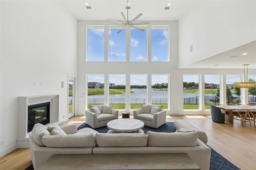 Unmatched Lakefront Views & Exclusive Contemporary Luxury
Experience a remarkable lifestyle just one hour from Dallas and 30 minutes from downtown Fort Worth. This exquisite contemporary estate, located in the prestigious, gated & guarded community of The Resort, offers direct lake access, world-class amenities, and a private golf course, all with breathtaking water views. This custom-built home is in pristine condition. Spanning 4,650 square feet, it features five bedrooms and five and a half bathrooms, all designed for effortless one-story living. The main floor includes a luxurious primary suite, two additional bedrooms, three bathrooms, and expansive living areas, while a versatile home gym can serve as a sixth bedroom.The upper level offers guest accommodations with two bedrooms, a Jack-and-Jill bath, and a spacious game room.This immaculate estate provides stunning waterfront views and front-row access to the beauty of Eagle Mountain Lake. This property is a true sanctuary where luxury and nature converge, making it an exceptional place to call home