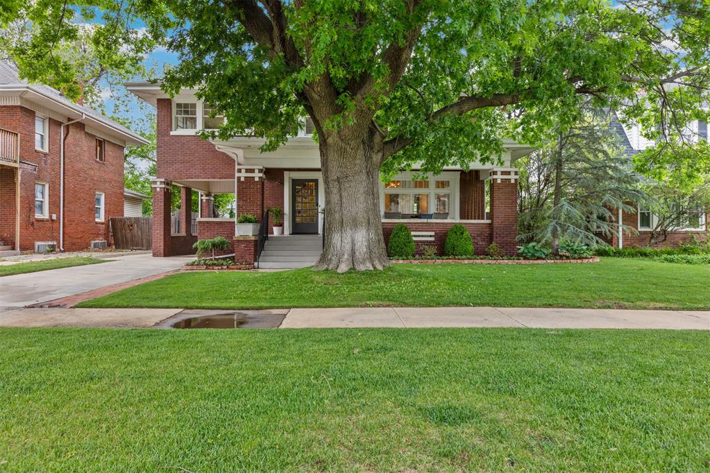 Historic charm meets beautifully renovated interiors in the most sought out home in Gatewood. Walking distance to the top rated Classen School of Advanced Studies! Framed by mature trees and lush landscaping, this home welcomes you with an expansive front porch with room to dine, gather, or enjoy a quiet morning. Inside, original hardwood floors, crystal doorknobs, and abundant natural light complement custom cabinetry, designer fixtures, and a soft, timeless color palette. The spacious kitchen and updated baths bring modern comfort to the home’s classic character, while a generous laundry/mudroom and plentiful storage make everyday living easy. Four bedrooms offer flexibility for a dedicated study, playroom, or guest space. The basement provides additional room for a home gym or hobbies; plus, enjoy a dedicated storage room in the basement. A spacious back porch extends the living outdoors, and the oversized two-car garage offers the perfect space for additional storage or a workshop. With inviting spaces and thoughtful details throughout, this historic home pairs the character you love with the functionality you need.