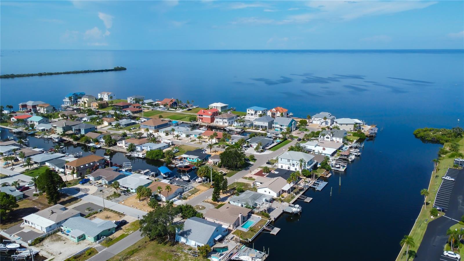 IF YOU ARE A MARINER, YOU WANT THIS LOT! DEEP, WIDE CANAL AND ACCESS TO THE GULF IN SECONDS! BE A PART OF THE SEA RANCH COMMUNITY! GOLF CART FRIENDLY, GREAT COMMUNITY CLUBHOUSE. SELLER FINANCING AVAILABLE WITH A MINIMUM OF 20% DOWN. This a wonderful opportunity for a RENTAL PROPERTY, FULL TIME HOME OR VACATION HOME. Are you ready to see DOLPHINS AND MANATEES IN YOUR BACKYARD WHILE YOU ENJOY A SWIM IN THE POOL? How about SPECTACULAR SUNSETS? Do you want to live in a community with NO HOA? How about the ability to KEEP YOUR BOAT, JET SKI AND WATER TOYS ON YOUR OWN PROPERTY? This fabulous floorpan is spacious and also can CONVERT TO A 3 BEDROOM HOME EASILY. You can make the interior however you'd like, you can't change this desirable and stunning waterfront lot. NEWER ROOF, AC, AND POOL PUMP.