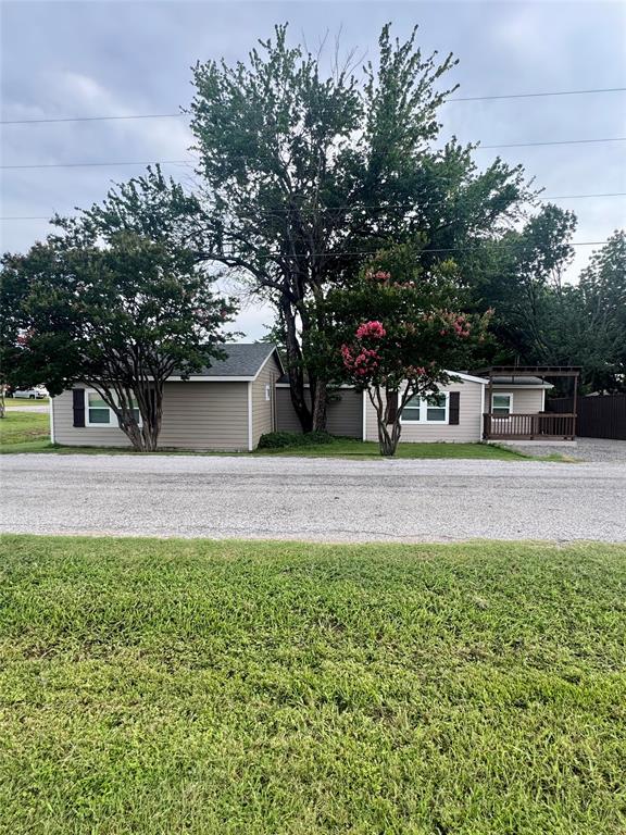 Welcome to this beautifully renovated (fully furnished) 3-bedroom, 2.5-bath home situated on a spacious corner lot just minutes from Lake Texoma and Highport Marina. Completely updated with modern finishes while maintaining its inviting charm, the home features an open-concept layout, spacious living areas, a beautifully remodeled kitchen, and comfortable bedrooms designed for relaxing after a day on the lake. The primary suite offers a private retreat with an updated en-suite bath, while the additional bedros provide ample space for family and guests.Outside, you'll find a large detached garage with plenty of room for vehicles, boats, golf carts, workshop space, or additional storage—perfect for lake living. Also, room for an RV with 50 amp. service on property. Its prime location near Highport Marina, restaurants, and some of the best boating, fishing, and recreation Lake Texoma has to offer makes it highly desirable. Offered for between a 5 -9 month lease term.
