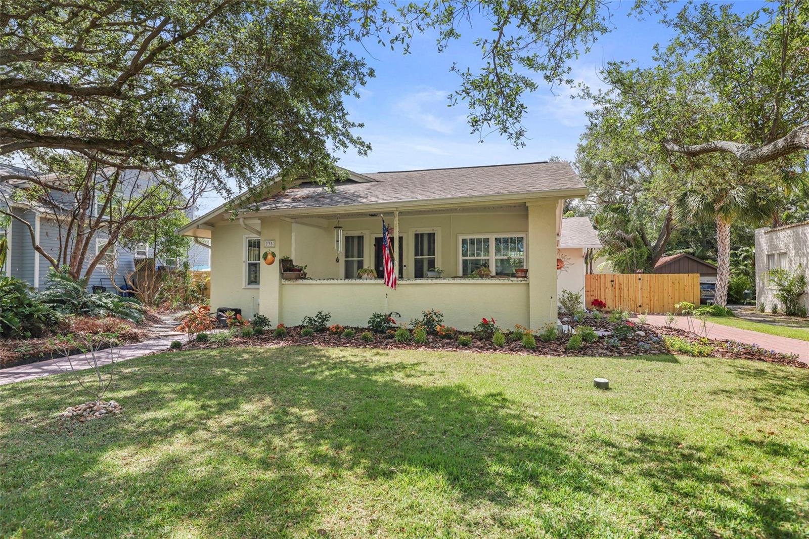 Charming Downtown Dunedin Retreat with Pool, INCOME POTENTIAL or Guest Apartment (ADU), Stunning Upgrades & water views from the front porch and driveway! Nestled among majestic oak trees in Historic Downtown Dunedin, this beautifully updated home blends timeless charm with modern luxury, offering breathtaking sunset and waterfront views right from the front porch. Located just a short stroll from the vibrant downtown district, this home provides an unparalleled lifestyle where you can walk to the Fenway Hotel for rooftop cocktails, explore the eclectic shops and restaurants of Main Street, or hop on the Pinellas Trail for a scenic bike ride along the coast. Whether you prefer a leisurely golf cart ride through town or a relaxing evening taking in the stunning Gulf views, this location truly has it all. Inside, the open floor plan of the main house which is a 3 bed 3 bath is flooded with natural light, highlighting the gleaming wood floors and elegant French doors. Every bedroom includes a full en-suite bath, offering a private retreat for all occupants. The living room features a stunning stone gas fireplace, while the dining area boasts a cozy wood-burning fireplace, setting the perfect ambiance for entertaining. The kitchen is a true showpiece, completely remodeled with custom cabinetry, quartz countertops, a Brazilian granite island, a GE five-burner gas oven, glass tile backsplash, and solar tube lighting. A beverage station with instant boiling water, a beverage fridge, and a pantry makes hosting effortless. The primary suite, added in 2010, serves as a luxurious retreat with his and her closets and a beautifully designed en-suite bath. The outdoor space is just as impressive, with a spacious screened-in porch that overlooks a refinished Pebble Tech pool and a tropical Tiki bar, perfect for entertaining or unwinding in your private oasis. The newly sealed front and back pavers add a fresh, polished touch to the already stunning curb appeal, while a red brick driveway and walkway lead to a beautifully fenced yard. An outdoor shower with premium fixtures offers added convenience after a day at the beach or on the water. Additional updates include gutters and drain spouts for both the main and guest houses, as well as roof clips for enhanced wind mitigation. Off the pool there is a large garage space and a pool bath. For added flexibility, a separate second-story guest apartment that has a separate electric meter box provides private living quarters, complete with a full kitchen, living and dining areas, a bedroom, and a bathroom, making it ideal for guests, in-laws, or generating rental income. The back house has its own separate electric meter, offering a convenient setup for renters. Recent upgrades include a new AC system, PGT hurricane-impact windows, a newly installed hurricane-rated door, granite kitchen countertops, a new oven and refrigerator, and a washer and dryer. Located in the heart of one of Florida’s most sought-after coastal towns, this home offers an unbeatable lifestyle. Enjoy world-class dining, boutique shopping, lively festivals, and scenic waterfront parks—all within walking distance. Take in breathtaking sunsets from your front porch, or spend your days exploring the best of Dunedin by bike or golf cart. Whether you’re looking for a full-time residence, a vacation getaway, or an income-producing property, 235 Aberdeen Street is a rare opportunity to own a piece of paradise. Schedule your showing today!
