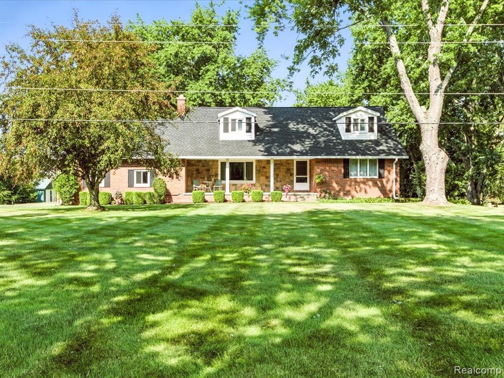 Spacious 5-bedroom, 2 full/2 half bath home on nearly 14 scenic acres just minutes from town! This well-maintained property offers the perfect blend of privacy, convenience, and functionality. Features include an open-concept living area, large kitchen with island and dining area, main-floor laundry, and a private primary suite. 2.5 car garage with a basement stair access. Enjoy outdoor living with a 32&#215;48 pole barn (concrete floor, electric, and wood stove), a smaller barn 12x28, a fully stocked pond, wildlife, and plenty of space for recreation or hobby farming. Great property for a small business owner. Located on a paved road with city water and sewer — a rare combination for a country setting! Ideal for those seeking land, space, and versatility. Located near St. Clair Country Club. Must see to appreciate!