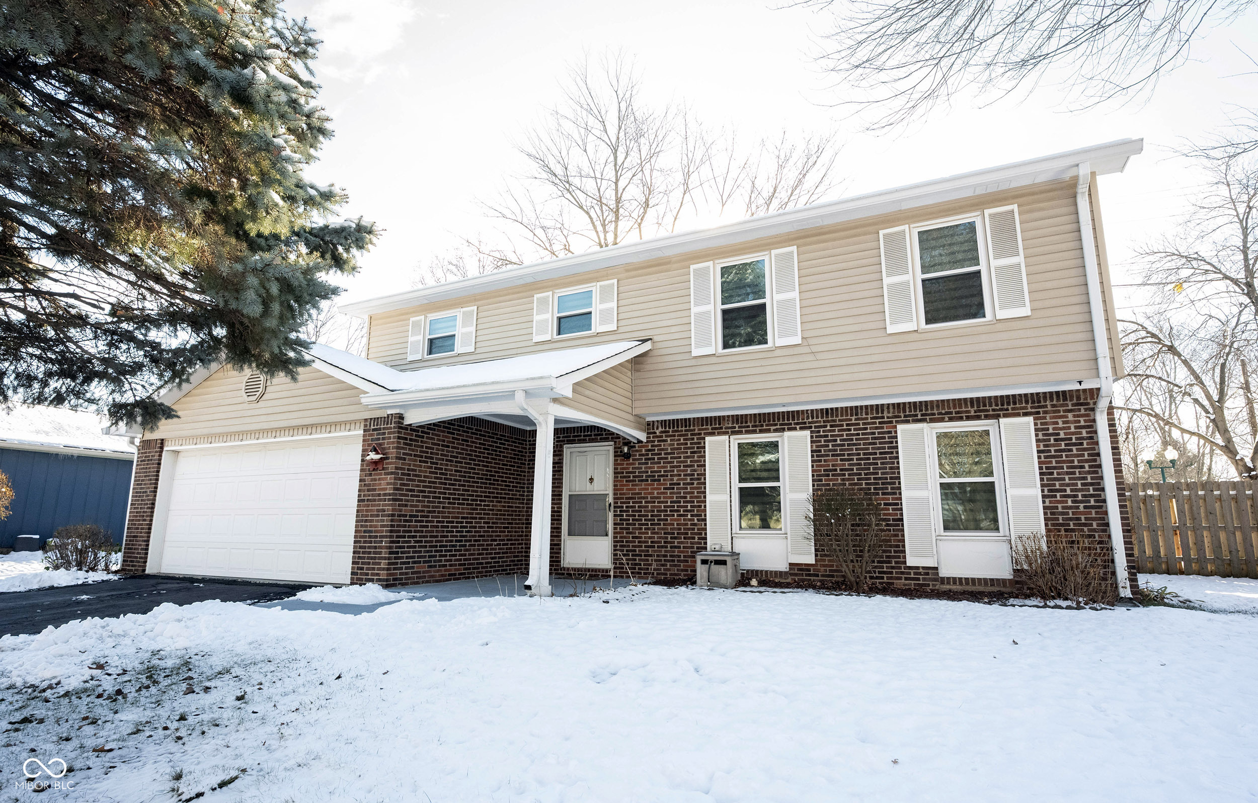 Welcome to 7511 Madden Dr., Fishers, IN - a move-in-ready single-family home in Hamilton County with no HOA and a long list of valuable updates.    This inviting two-story residence offers 4 bedrooms, 2.5 baths, and 2,154 sq. ft. of comfortable living space on an 8,276 sq. ft. lot. Built in 1980, the home has been thoughtfully maintained and modernized, giving buyers peace of mind from day one.    Step inside to a warm and welcoming living room where the fireplace adds cozy charm-perfect for quiet evenings or lively gatherings. The beautifully remodeled kitchen (2019) features shaker cabinets, stone countertops, a stylish backsplash, and a convenient peninsula for casual dining or entertaining. All kitchen appliances remain, and the garage refrigerator and garage freezer are also included.    The fenced backyard provides both privacy and functionality with plenty of room to unwind. Enjoy outdoor dining or relaxation on the patio, and take advantage of the storage shed for tools and yard essentials.    Upstairs, the home offers four comfortable bedrooms, including a bathroom with a walk-in shower in the primary. With 2 full baths and 1 half bath, morning routines are effortless.  The second bathroom upstairs has a walk in jacuzzi tub.  This home has been updated with major improvements, including:    New heat pump, furnace and windows (2021)    Steam humidifier added to furnace (2021)    New water heater (2022)    Kitchen remodel (2019)    New roof (2011)    Residents can also enjoy nearby community amenities such as walking/bike paths, basketball courts, volleyball courts, and a playground, just moments away.    With classic charm, modern updates, no HOA, and an excellent Fishers location, this property offers the perfect blend of comfort, convenience, and value.