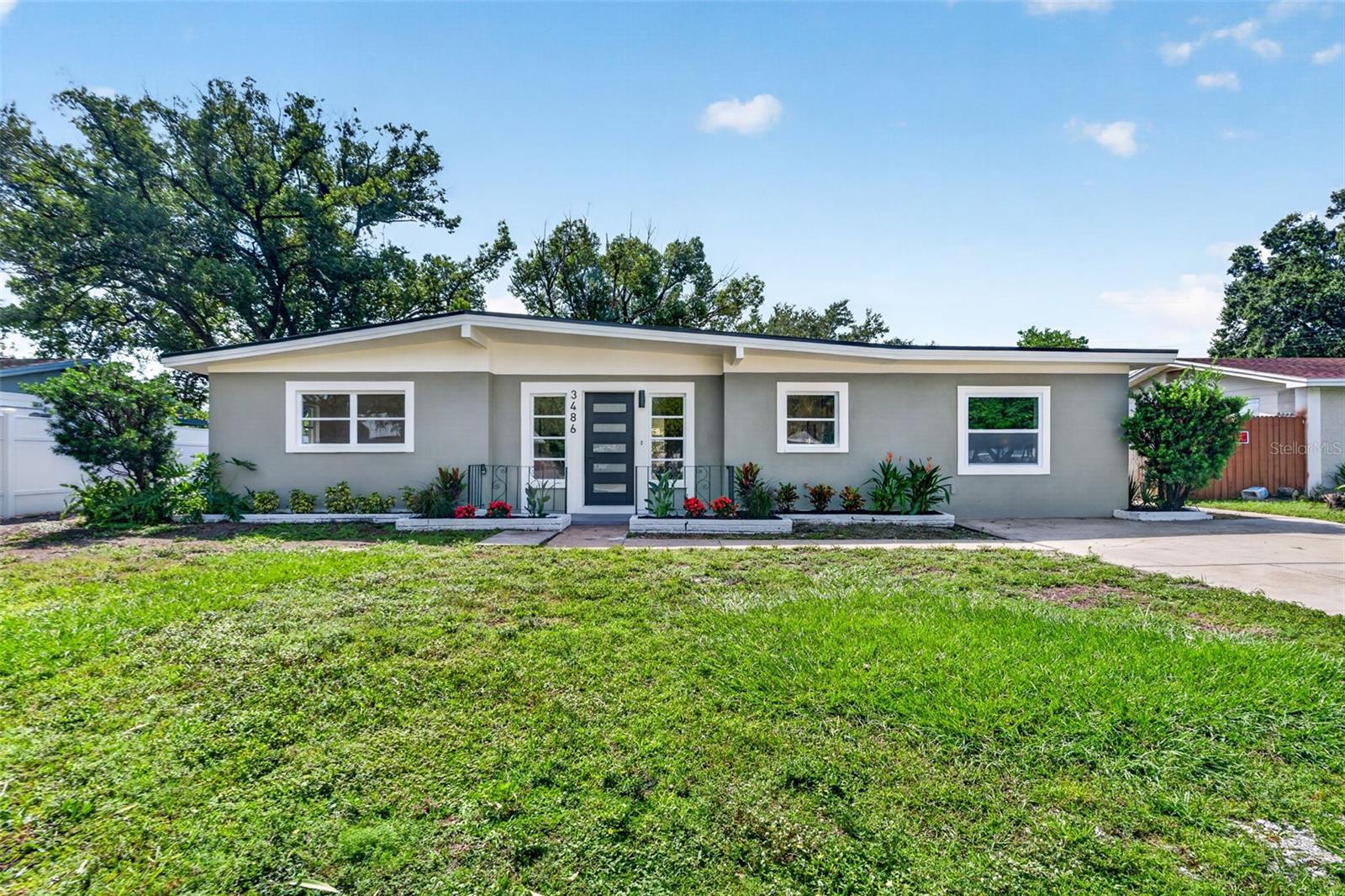 Welcome to a completely renovated 3-bedroom, 2-bath home where the big-ticket items are already done for you. Brand new roof, new A/C and ductwork, a full rewire with a new electrical panel, and updated plumbing mean true peace of mind from day one.Inside, vaulted ceilings in the living room and both guest bedrooms make the home feel open and airy. The true split floor plan gives the primary suite its own private retreat, away from the guest rooms.The kitchen is a showstopper with brand new oak-colored slim shaker cabinets, Taj Mahal quartzite counters, and stainless steel appliances. The same counters carry into both bathrooms, where natural stone luxury lighting adds an elevated, spa-like touch. The primary bath features a double shower head shower, a daily luxury you'll love.Fresh paint inside and out and solid core doors throughout give the home a crisp, quiet, quality feel.Located in Largo, you're minutes from the beaches of Clearwater, Indian Rocks, and Belleair, with Largo Central Park, Walsingham Park, and the Pinellas Trail close by for biking, walking, and outdoor fun. Shopping, dining, and major routes are all nearby, making commuting across Pinellas County and into Tampa easy.Nothing to fix, nothing to update. Just bring your furniture and start living the Florida lifestyle.Schedule your private showing today.