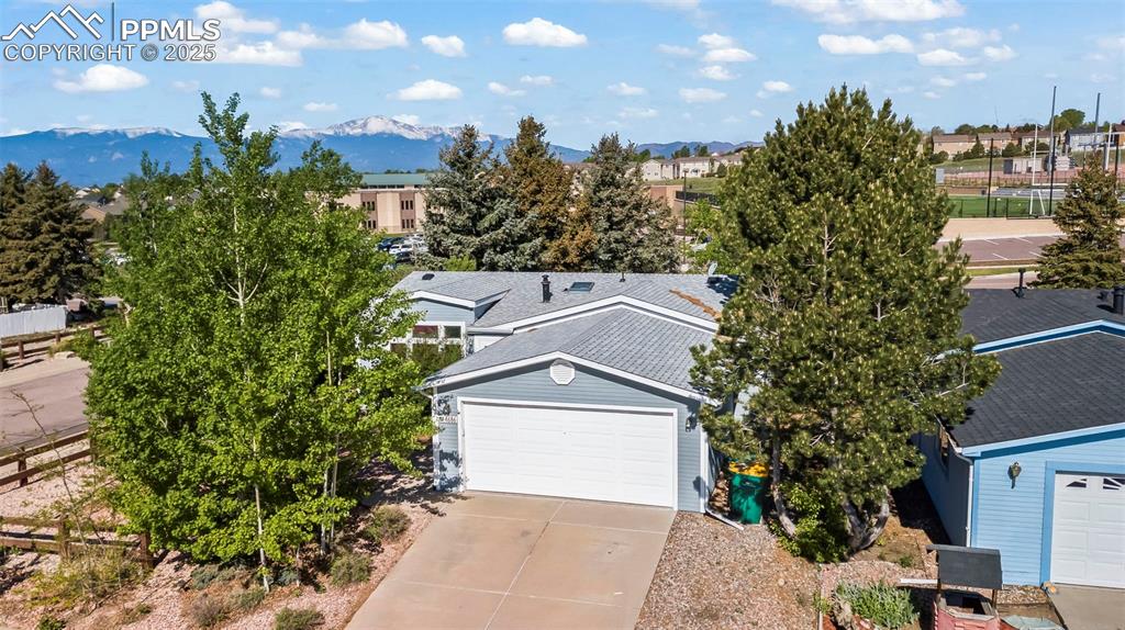 ***See the Amazing Video at the Virtual Tour Link on the listing*** 

This beautifully maintained ranch-style home offering one-level living in the highly desirable Chateau at Antelope Ridge community. This charming 3-bedroom, 2-bathroom home sits on a corner treed lot and boasts sweeping views of Pikes Peak and the Front Range, blending comfort, convenience, and Colorado beauty.

Step inside to find new paint and carpet, high ceilings, and a light-filled layout enhanced by a skylight in the bathroom. The spacious living area connects to a functional kitchen with stainless steel appliances, and the washer and dryer are included for added ease.

Enjoy the outdoors in your own private oasis featuring a landscaped front and back yard with a sprinkler system, a wood deck with a pergola, and a covered hot tub area—perfect for relaxing in every season.

This home is located in a very well-maintained community that offers a pool, fitness center, and clubhouse, with monthly social events that create a welcoming and active atmosphere for residents.

With thoughtful upgrades, stunning mountain views, and a vibrant neighborhood, this home is a rare opportunity—schedule your private tour today!