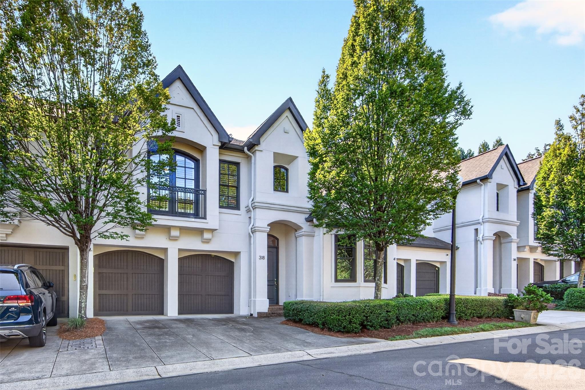 Stylish gated townhome community offering bright, airy spaces and private outdoor areas. This spacious three-bedroom residence was fully remodeled in 2022 and features an open floor plan with high ceilings, hardwood flooring and abundant natural light. The main level is ideal for entertaining, with connected living, dining, and kitchen areas. The updated kitchen includes Bosch stainless appliances, walnut and quartz countertops, and excellent storage. The second floor provides three bedrooms (one is being used as an office), a laundry area, and two full baths. The generous primary suite includes a large walk-in closet and a beautifully appointed bath with custom cabinetry, dual sinks, tile finishes, a frameless shower, and soaking tub.A two-car garage offers privacy, safety, and additional storage. Conveniently nestled between the Cotswold and Eastover neighborhoods, this home is minutes from Uptown, and SouthPark and Cotswold shopping.