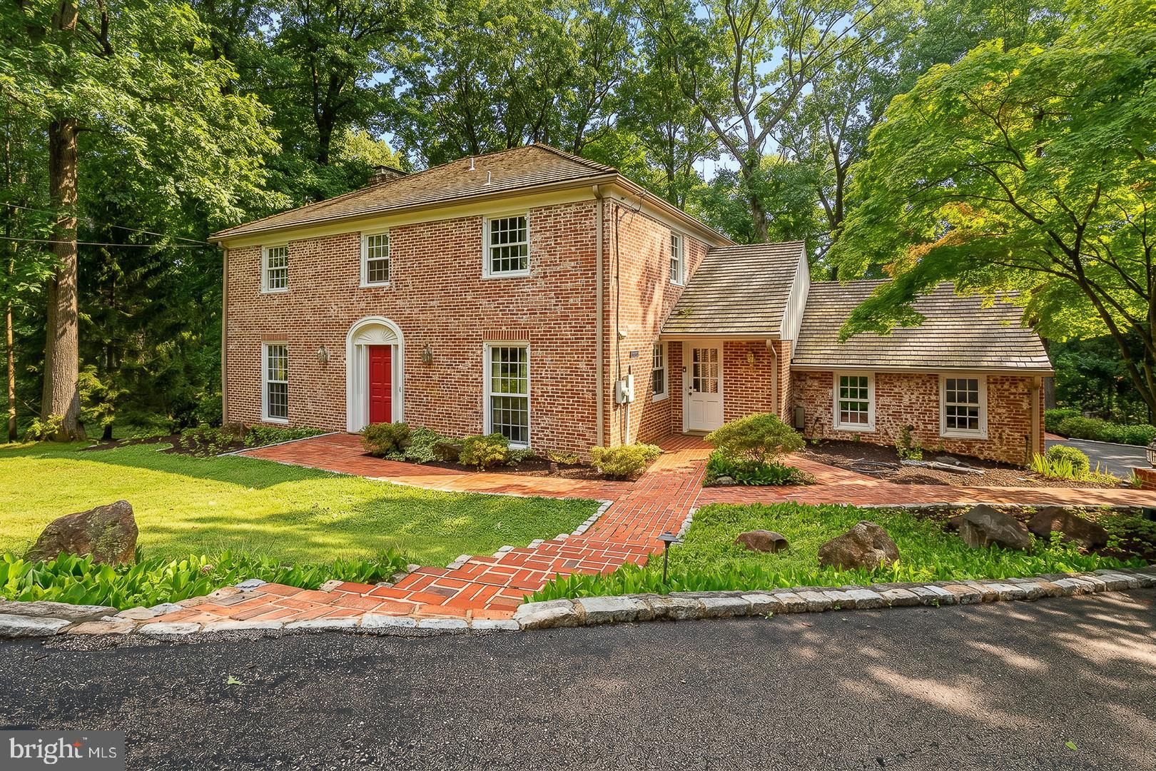 Welcome to 577 Tory Hill Road, a well-maintained two-story Colonial located in Devon's highly sought-after Shand Tract community. Offering 4 bedrooms, 2 full baths, and 2 half baths, this spacious home combines classic charm with exceptional indoor and outdoor living spaces, creating the perfect setting for everyday living and entertaining. The main level features hardwood flooring and recessed lighting throughout, creating a warm and inviting atmosphere. The spacious living room offers a cozy fireplace, while the formal dining room is accented by crown molding and chair rail. The kitchen is equipped with stainless steel appliances, solid-surface countertops, a 5-burner gas cooktop, wall oven, and ample workspace. A versatile office or potential 5th bedroom includes a closet and built-ins. The year-round sunroom addition features hardwood flooring, vaulted ceiling, ceiling fan, skylights, and French doors that open to an expansive 800+ sq ft deck, providing seamless indoor-outdoor living. A ceramic tile powder room completes the main level. The second floor features hardwood flooring throughout. The spacious primary suite, featuring a large skylight and recessed lighting, includes a private ensuite bath with ceramic tile flooring, a tiled shower, and frameless glass doors. Three additional generously sized bedrooms, including one with wall-to-wall carpeting, and a full hall bath with jetted tub/shower complete the second floor. A walk-up attic with a cedar closet provides excellent storage. The fully finished walkout lower level is designed for entertaining and relaxation. The raised-panel entertainment room features a custom-crafted wet bar, large wine cellar, ceramic tile flooring, recessed lighting, and French doors leading to a covered brick patio. A separate family room offers a dramatic raised-hearth, full-wall brick fireplace, recessed lighting, and French doors opening to a beautiful walled brick terrace. A laundry room and ceramic tile half bath complete this level. The outdoor living spaces truly set this home apart. Enjoy entertaining or relaxing on the expansive 800+ sq ft deck overlooking the walled brick terrace and backyard, or gather on the impressive walled brick patio with direct access to the walkout lower level. Additional highlights include HVAC replaced in 2015, a two-car side-entry garage with automatic opener and interior access, and a home that has been meticulously maintained and lovingly cared for over the years. This exceptional property offers outstanding space, quality construction, and an incredible opportunity to personalize a spacious home in one of Devon's most desirable neighborhoods.