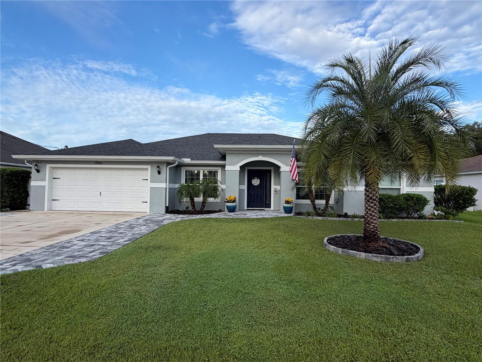 Built in 2020, this SeaGate Worthington II sits at the end of a quiet cul-de-sac in the desirable Matanzas Woods subdivision at the north end of Palm Coast. It's a LOVELY and SPACIOUS FIVE-BEDROOM, THREE-BATH HOME that offers versatility with its 2,464 square feet of living space, a dedicated OFFICE/DEN, a MOTHER-IN-LAW SUITE, and INTERESTING ARCHITECTURAL FEATURES, such as ARCHED ENTRYWAYS, VAULTED CEILING, BULLNOSE CORNERS, and MORE, making it quite pleasing to the eye. What really sets it apart, though, is the PRIVATE GUEST WING: the owners had the builder add a sound-insulated wall and an interior connecting door joining two bedrooms, one with its own FULL BATH, creating a QUIET RETREAT for family members (the "MOTHER-IN-LAW SUITE"), extended-stay guests, or a live-in caregiver. The real HEART OF THE HOME is the EFFICIENT KITCHEN with its SOLID WOOD CABINETRY, QUARTZ COUNTERS and COUNTERTOP BAR, anchoring everything with a LARGE ISLAND, WALK-IN PANTRY, and EAT-IN CAFE that all opens up to the cozy and comfortable GREAT ROOM! The OPEN CONCEPT SPLIT-PLAN has three bedrooms on the North side of the home, with another bedroom facing East and the MASTER BEDROOM on the South side, with its spacious and comfy vibes and TWO WALK-IN CLOSETS. It also includes an EN-SUITE MASTER BATHROOM with a WALK-IN SHOWER and a WALK-IN THERAPY TUB ("Safe Step Walk-In Tubs") that will bring you so much enjoyment! The tub includes BLUETOOTH for MUSIC, a HEATED SEAT, MULTI-JETS, and COLORFUL LED LIGHTS all built in and designed to improve blood circulation, ease arthritis pain, and loosen tight muscles, as well as provide TOTAL RELAXATION! This home is just PERFECT for ENTERTAINING FAMILY AND FRIENDS, or relaxing after a busy day, especially when you step outside into the PRIVATE PARADISE that includes a LARGE COVERED LANAI, LOW-MAINTENANCE SWIMMING POOL with ELEVATED DECKING, SHED with SHELVING AND FLOORING, and LANDSCAPED GROUNDS, all connected with PAVED WALKWAYS and enclosed by a FULLY-FENCED YARD! This is FLORIDA LIVING at its absolute BEST! Additional attributes include a 2-Car Garage, widened driveway for additional parking, LIGHTS that frame the LARGE YARD, and more! Newer construction means 2020 Roof & HVAC, along with hurricane-rated windows and LOW-MAINTENANCE OWNERSHIP. Being mere minutes away from the Matanzas Woods Parkway I-95 interchange and US-1 provides convenience to many of the hottest retail properties in Flagler County, including Shopping, Dining and Entertainment, as well as Doctors & Hospitals, Recreation, Parks, and our beautiful FLORIDA BEACHES! Schedule a showing today and check out this impeccable home ASAP!