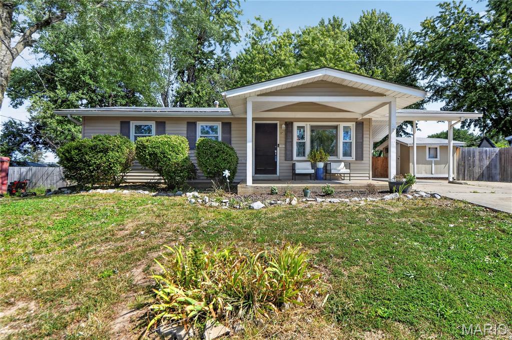 Location…location!  This ranch-style home offers updates with a setting that’s hard to beat. A carport with attached shed provides both parking and storage, a large, level fenced backyard with 2 additional sheds and a covered patio for all your outdoor needs.  Inside you’ll find lots of updates like flooring, appliances, fixtures, doors, etc. Living room has a bright, airy feel with a large picture window. The kitchen is as functional as it is charming with stainless steel appliances, tile backsplash and direct access to that huge backyard perfect for outdoor entertaining. The main floor includes 3 generous sized bedrooms and an updated bath. Updated lighting adds a modern touch throughout the home. Downstairs, the mostly finished basement expands your living space with plenty of room for relaxing, hobbies, or a home office plus a full bath. This is a move-in ready home that combines thoughtful updates with an exceptional lot.  This one won’t last long and is ready for you to call it home.