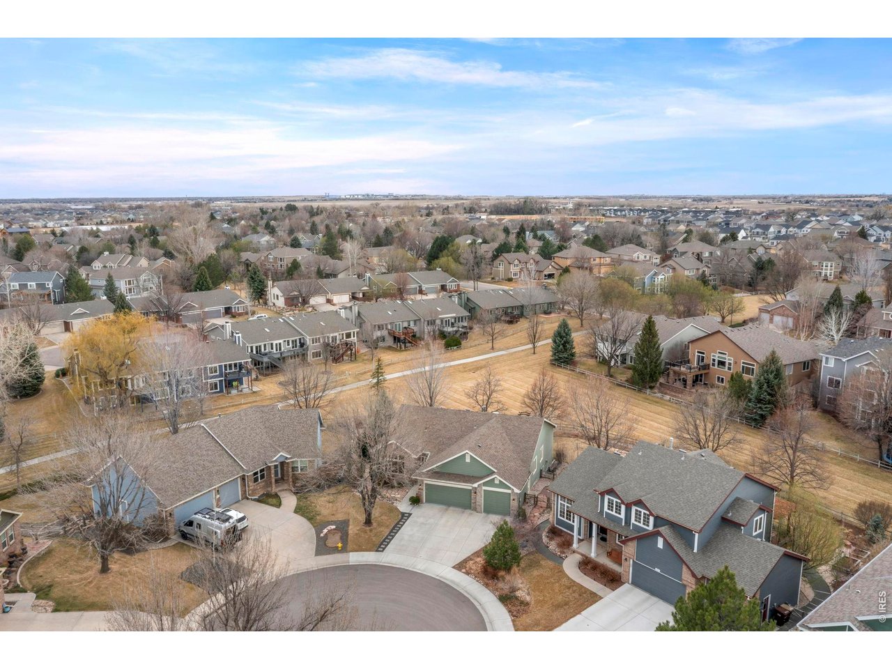 Welcome to 1821 Feltleaf Ct - a stunning 5-bedroom, 3-bathroom ranch in the sought-after Willow Springs neighborhood, nestled on a prime .30-acre end-of-cul-de-sac lot backing to community greenbelt and open space. Enjoy the ease of 100% main floor living with 3 bedrooms, 2 bathrooms, a dedicated office, formal dining room, and a beautifully updated entertainer's kitchen - all flowing over rich hardwood floors. The fully finished walkout basement expands your living space with 2 additional bedrooms, a full bathroom, spacious family room, and a rec room featuring a wet bar and gas fireplace - perfect for hosting. Step outside to take in breathtaking evening sunsets from the large deck or unwind on the patio below, surrounded by mature landscaping, lush garden beds, and a cozy fire pit. The primary bathroom has been completely refreshed with modern finishes. With no rear neighbors, a premier lot position, and thoughtful updates throughout, this home is the total package - space, style, and serenity all in one. The information contained herein should be verified after buyer contracts to buy the property