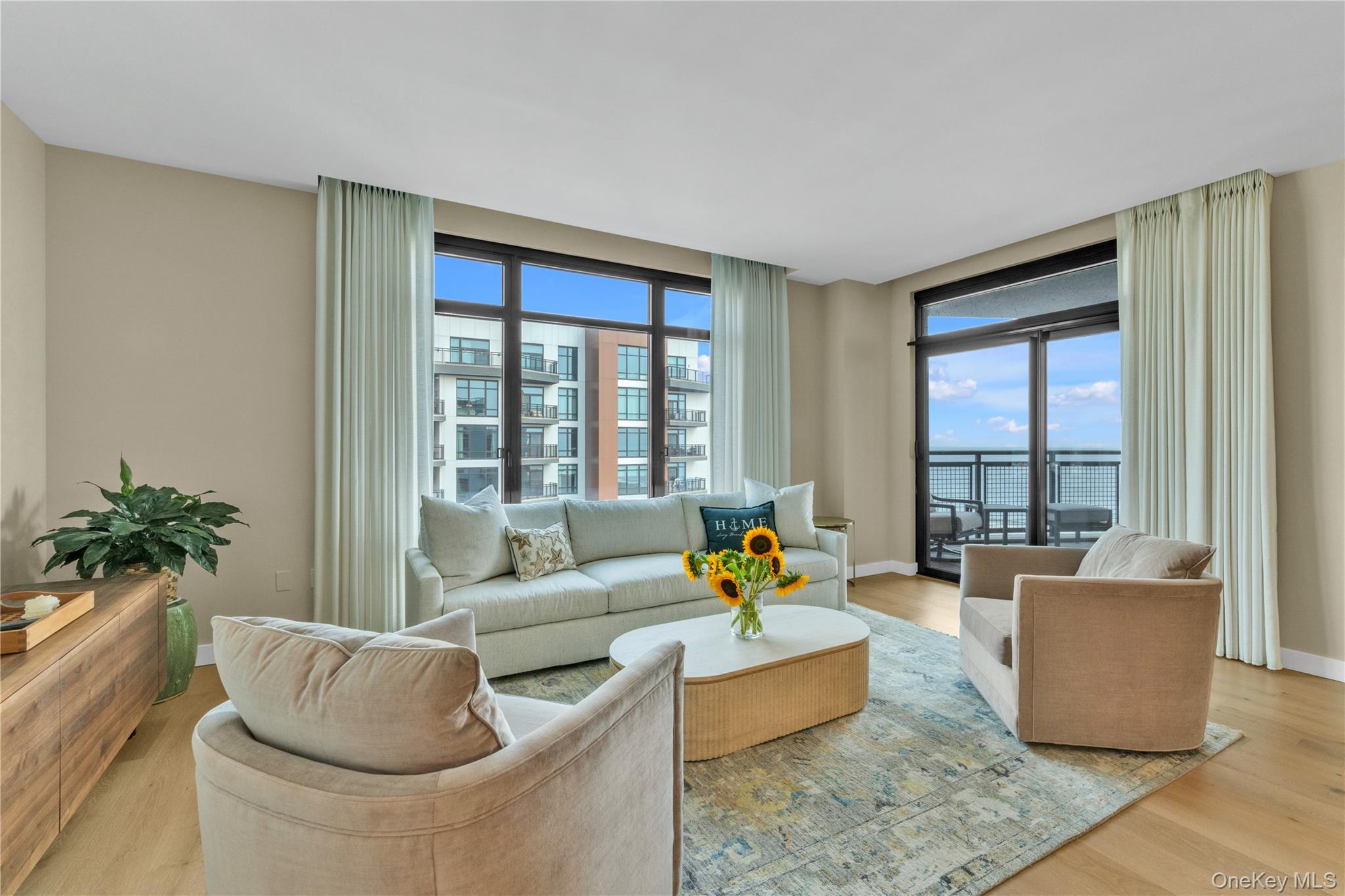 Experience elevated oceanfront living at The Boardwalk, Long Beach's most iconic luxury condominium. Be among the first to enjoy this exceptional ninth-floor opportunity in one of the city's most prestigious beachfront residences. Perfectly positioned directly on the Atlantic Ocean, this spectacular home offers the ultimate coastal lifestyle with private access to the beach and boardwalk, while remaining just moments from restaurants, shopping, entertainment, and the LIRR for an effortless commute to Manhattan.Designed with elegance and comfort in mind, this stunning residence features a bright, open-concept floor plan with floor-to-ceiling windows that flood the home with natural light. High-end finishes are showcased throughout, including a chef's kitchen with premium Bosch appliances, porcelain countertops, custom Italian cabinetry, and a seamless flow into the spacious living and dining areas—perfect for both everyday living and entertaining. Custom shades throughout the residence provide effortless privacy and convenience.The spacious primary suite offers a luxurious and beautifully curated retreat, featuring meticulously maintained custom grasscloth wallpaper and designer lighting, complemented by beautiful southeast-facing ocean views. The generously sized guest bedroom features its own walk-in closet and direct access to a beautifully appointed bathroom with a double vanity, providing exceptional comfort for family or guests. An in-unit washer and dryer, abundant closet space, and thoughtfully designed storage complete this truly turnkey residence.Life at The Boardwalk is defined by an unmatched collection of world-class amenities, including:* 24-hour concierge and valet service* Heated oceanfront saltwater swimming pool and Jacuzzi* State-of-the-art 2,500-square-foot fitness center* Infrared saunas* Elegant resident lounge and private dining room* Billiards room* Co-working and business spaces* Private card room* Beautifully landscaped outdoor terraces with fire pits* Outdoor grilling stations featuring granite countertops and flat-screen televisions* Putting green* Outdoor movie theater* Dog runs for both small and large dogs* Children's playroom* Access to tennis courts* Secure garage parking* Completely pet-friendly buildingFrom sunrise walks on the beach to relaxing evenings overlooking the ocean, this residence offers a true resort-style lifestyle unlike anything else on Long Island. Combining exceptional luxury, premier amenities, and an unbeatable oceanfront location, this is a rare opportunity to lease one of the few rental residences available in the highly sought-after Boardwalk Condominiums. Luxury, convenience, and beachfront living come together to create a truly one-of-a-kind place to call home.