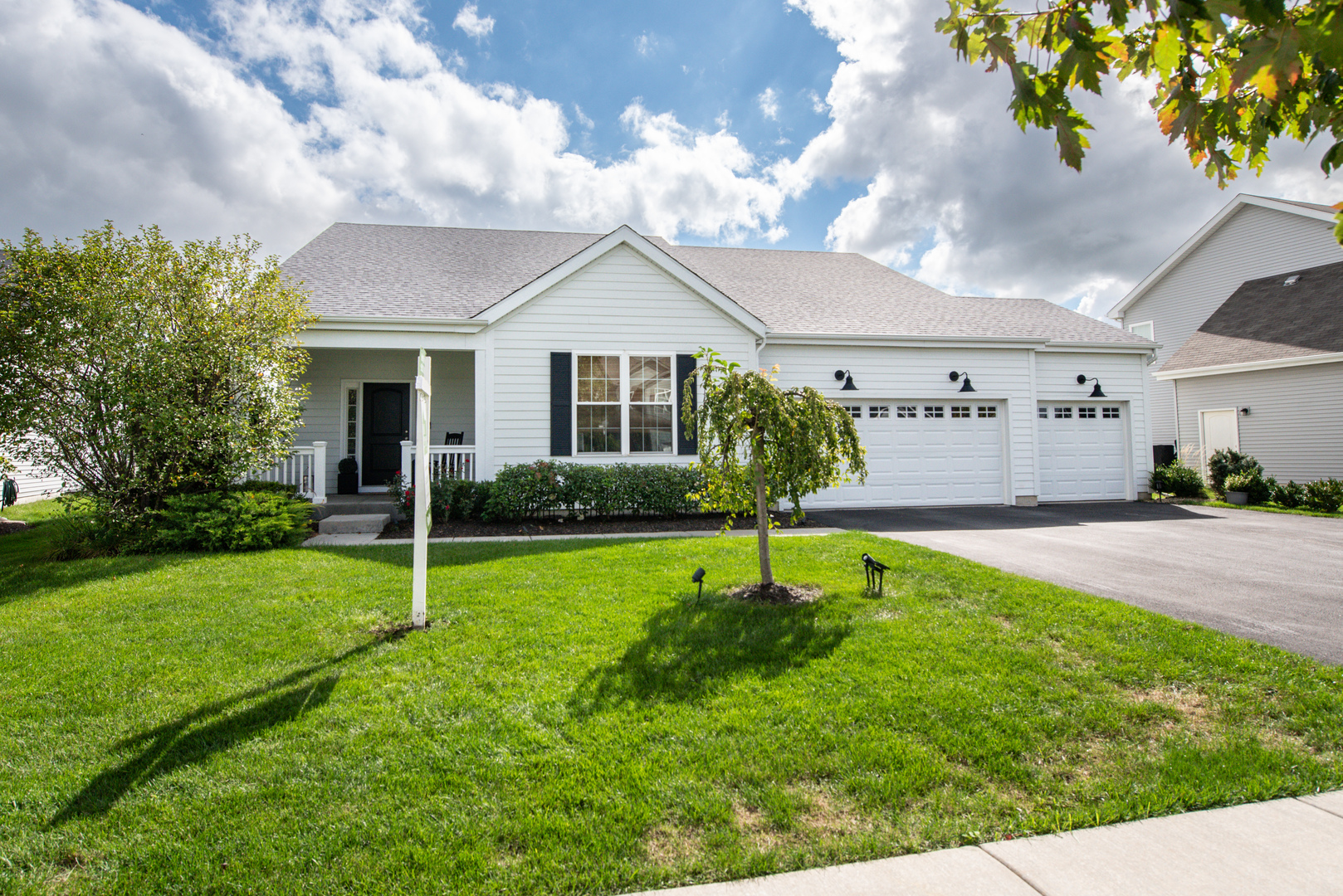Custom ranch built in 2019 with expansive & spectacular rear southeast-facing 10,974 SF, POND VIEW LOT (summer sunrise on the lanai/screened porch). Bring the outdoors in! Maintenance-free Hardy Board exterior on front and screened porch plus clad soffits & fascia. Maintenance-free vinyl on three sides.  Covered front porch with overhead light. Spacious entry foyer. Vaulted & nine-foot ceilings throughout, ceramic fireplace, skylight, and French/atrium doors in Family Room open onto aesthetic 20'x10' screened porch.  Step-saver kitchen features Shaker white cabinets, quartz counters, Whirlpool SS appliances, Samsung French-door refrigerator '23, extra-deep stainless sink, recessed ceiling lights, and above-cabinet lighting. Spacious walk-in pantry w/custom wood shelving. Luxury vinyl flooring throughout except ceramic baths.  Three bedrooms plus separate den/office, three full ceramic baths on the main floor;  BR#2 has a private ensuite bath for in-law/nanny/guest quarters; First-floor laundry/utility w/garage access. 3-car garage plus extra storage bay;  Lovely yard/pond view/landscaping with solar lighting, juniper trees, weeping cherry, hydrangeas etc. Full unfinished basement for future expansion or storage. High-efficiency direct-vent furnace and 40-gallon gas water heater. New architectural shingle roof, soffit, fascia. gutters, & skylight were just installed 9/26; Wall-hung TV in FR,  window treatments,& area rug in bsmt. included. Please see Feature Sheet & Disclosures under Additional Info. Ashcroft Swim & Clubhouse Membership available, details on Feature Sheet. Don't miss this ideal opportunity.