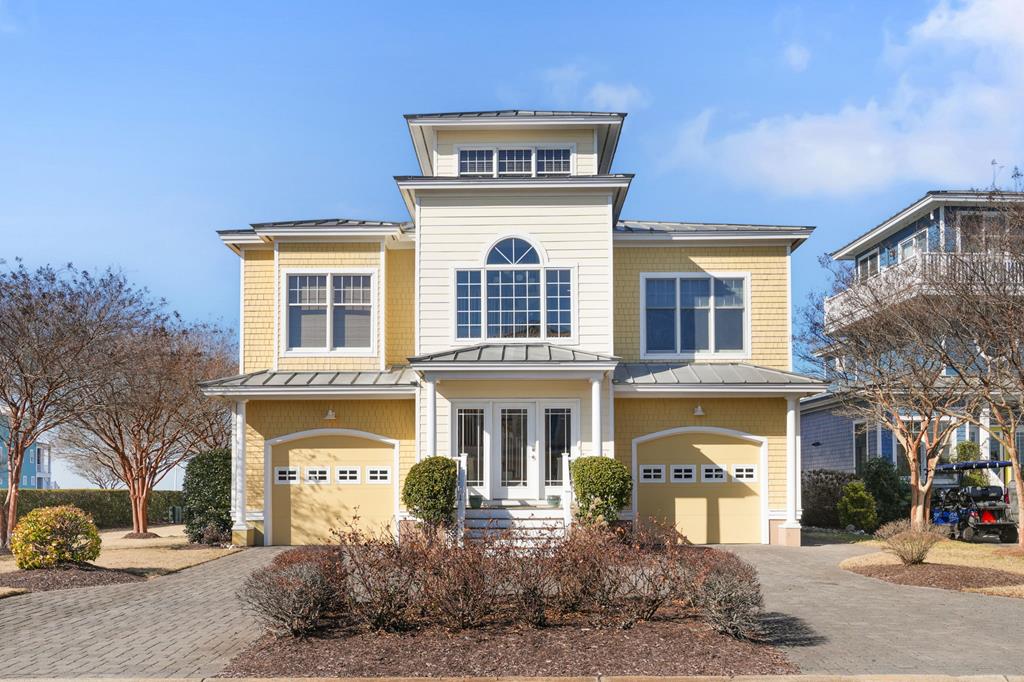 FULLY FURNISHED exceptional Bay Creek model home “The Bahama” situated on a corner lot, offering water views protected by public beach access. This home was thoughtfully designed with premium model upgrades, 1st floor primary suite, bamboo flooring upgrade, & 3rd floor sky room, you won't miss a sunset! Featuring 3 BDR & 3 full baths, plus a versatile 2nd floor room ideal for a 4th sleeping area, office, or study. Located in a gated community with access to private beach, tennis/pickle ball court, pool & NO mandatory membership. Offered FULLY FURNISHED, including outdoor poly furniture, golf cart, paddle boards, kayaks, and fully stocked kitchen-truly move in ready. Ideal investment property with strong seasonal rental appeal due to proximity to Pearl Event Center, Eatery, Marina & C-Pier