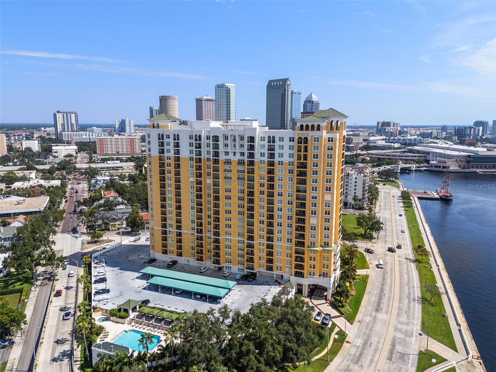 MAGNIFICENT WATER VIEWS OF THE BAY from the 18th floor Balcony and every room in this unit. Welcome to the elevated high-rise living at 345 Bayshore, one of Tampa's most iconic waterfront addresses where luxury living and spectacular water views come together on one of the nation's longest continuous sidewalk at 4.5 miles of waterfront and open bay beauty, Bayshore Boulevard. This upgraded, spacious and freshly painted unit with travertine flooring throughout offers a unique and open concept living space where floor-to-ceiling windows showcase the views and brighten the unit with natural light and bay breezes. This unit's layout is unique, offering a larger kitchen with a floor to ceiling mirror and granite countertops and a spacious living room. The primary suite is large enough for a king-sized bed and featuring a custom walk-in closet. The en-suite bath is pure luxury, with granite countertop and wood vanity, a walk-in glass shower, and porcelain tile finishes on floor and walls that feel like a spa retreat. The split floor plan offers privacy and function- a spacious guest bedroom showcasing breath-taking water views of the bay, French double doors that can change the functionality of the room and be used as a formal dining room, media room, office or a bedroom with a walk-in closet and an upgraded bathroom featuring a deep soaking tub and walls covered in porcelain tile. Washer and dryer included in the unit. This luxury high-rise building with its porte-cochere entrance, inviting lobby of marbled floors and dark wood offers a resort-style amenities including 24/7 concierge and security service, a private climate-controlled wine cellar, a stunning library, a recently renovated resort-style pool with fountains and luxe stone pavers, a SPA and sauna, two state of the art fitness centers, outdoor grills and social spaces, business center, club room with Wi-Fi, an elegant conference room with monitor and speakerphone, an EV charging stations, a car wash area, a storage for bicycles as well as paddle boards and kayaks, a private laundry room with front-load washer/dryer and custom storage, and exclusive access to two on-site guest suites for visiting friends or family. Best location- Steps from 345 takes you to all the restaurants, shops, attractions, activities and events in Hyde Park, Davis Islands, Harbor Island, Water Street, Sparkman Wharf, Channelside, the River Walk, the University of Tampa, Armature Works and a dynamic downtown. The building is also near top-rated schools (Gorrie Elementary, Wilson Middle School and Plant High) and Tampa General Hospital, and there's easy access to the Selmon Crosstown Expressway and I-275. Experience Florida luxury lifestyle at its finest. Additional Services included are water, sewer, trash, pest control & exterior window washing. Pets are welcome.
