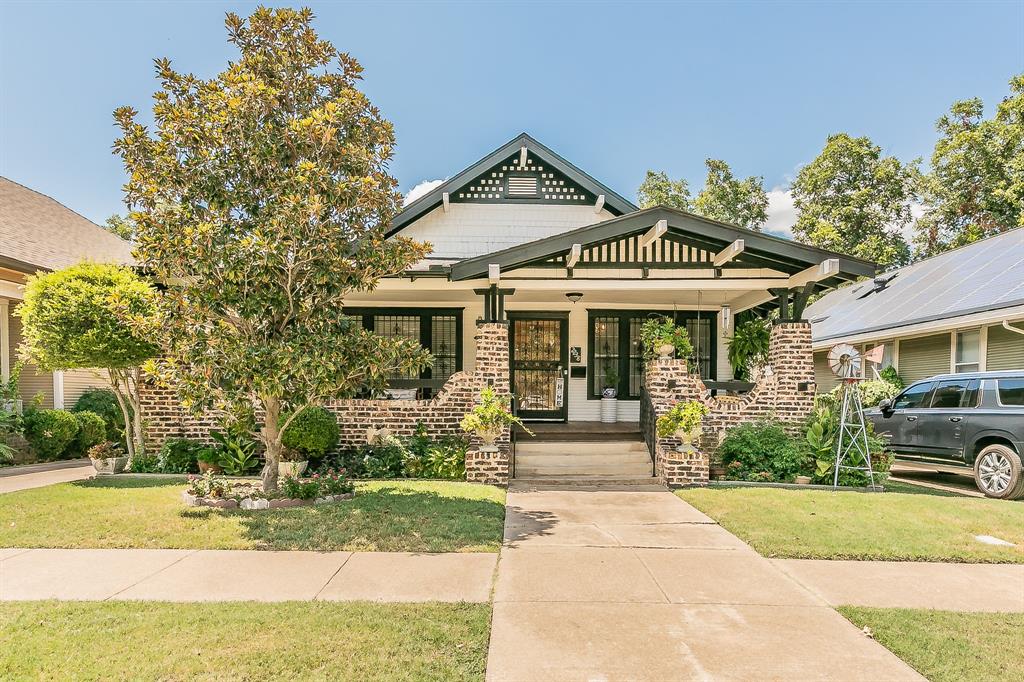 Nestled in the heart of the Historic Fairmount District, this timeless Craftsman blends 1920s charm with thoughtful modern updates. The light-filled main home features 3 spacious bedrooms, including a serene primary suite with a private bath, plus a flexible parlor with French doors—ideal for an office or library. Original wood floors, detailed moldings, antique brass fixtures, and custom built-ins highlight the home’s craftsmanship.Enjoy a gas fireplace framed by built-in shelving, a formal dining area, and tastefully updated bathrooms. Outdoor living includes a welcoming wraparound porch and a private back deck.An oversized garage with an additional 750+ SF (not included in the listed square footage) provides flexible space for guests, work, or hobbies. Conveniently located near Magnolia Avenue dining and shopping, and approximately 10 minutes to Downtown Fort Worth, offering a variety of dining, entertainment, and retail options.Don’t miss the opportunity to see this unique property—schedule your showing today.
